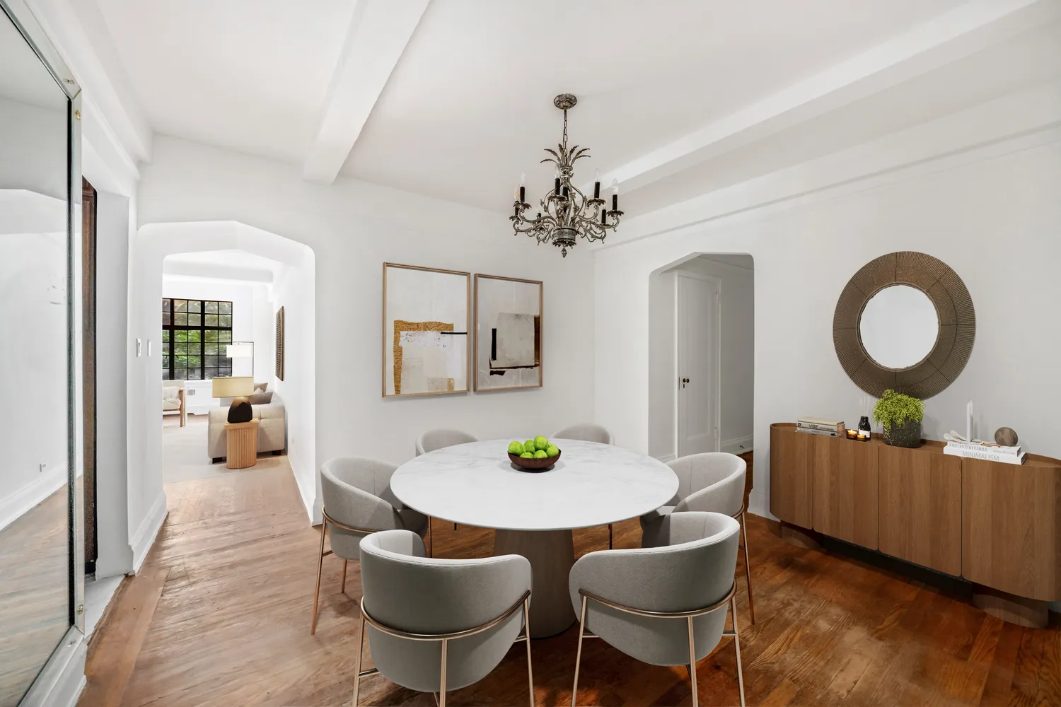 a living room with furniture and a mirror