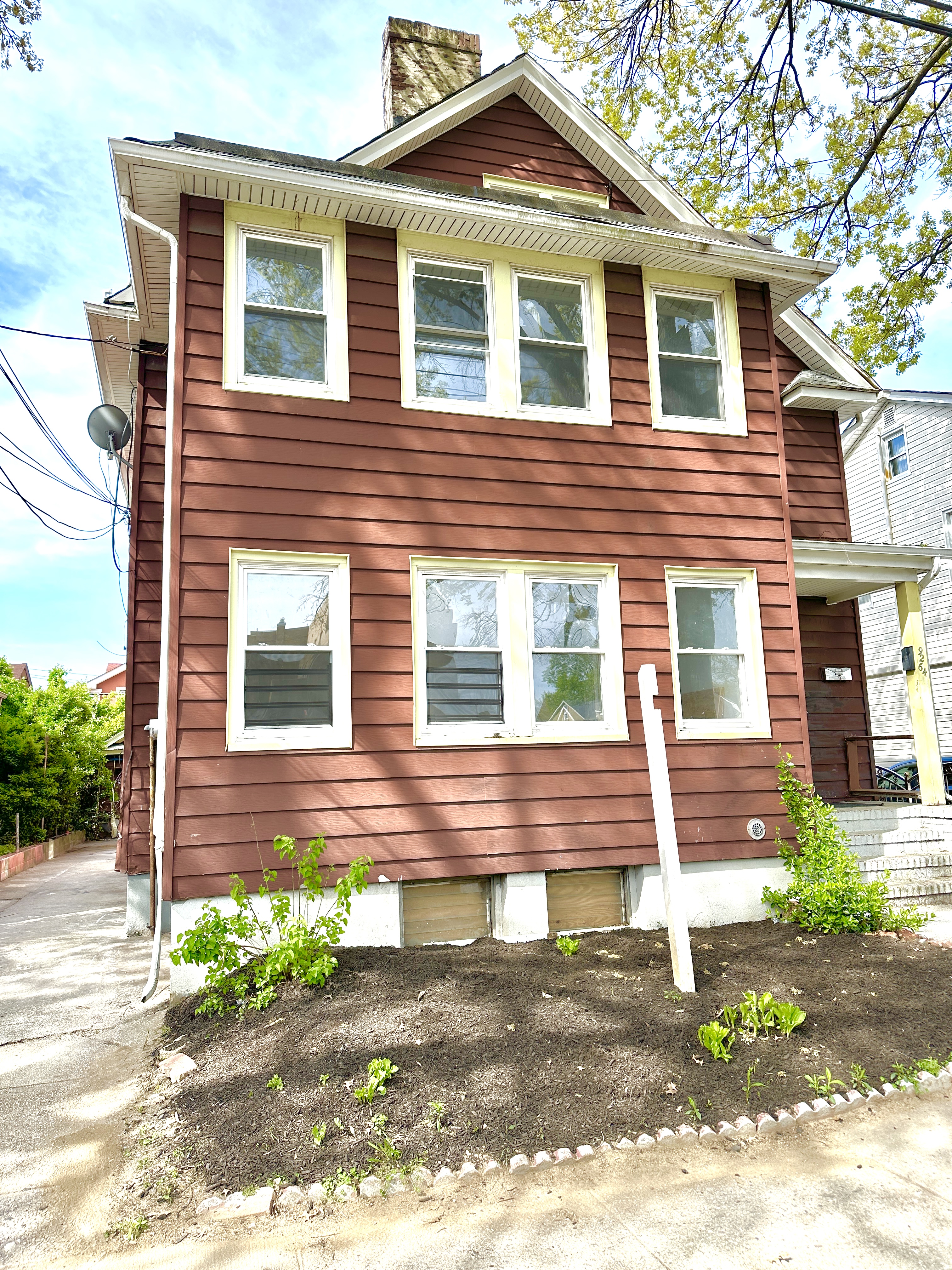 92-64 Springfield Boulevard Queens, NY 11428 - Photo 2 of 25 a front view of a house with a yard