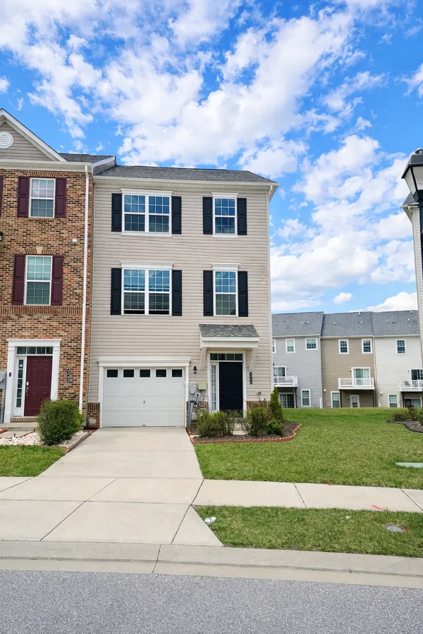 a front view of building with yard