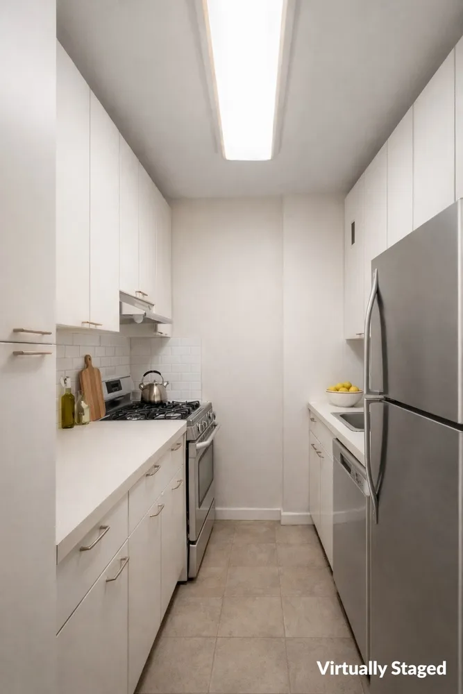 a kitchen with a refrigerator sink stove and cabinets