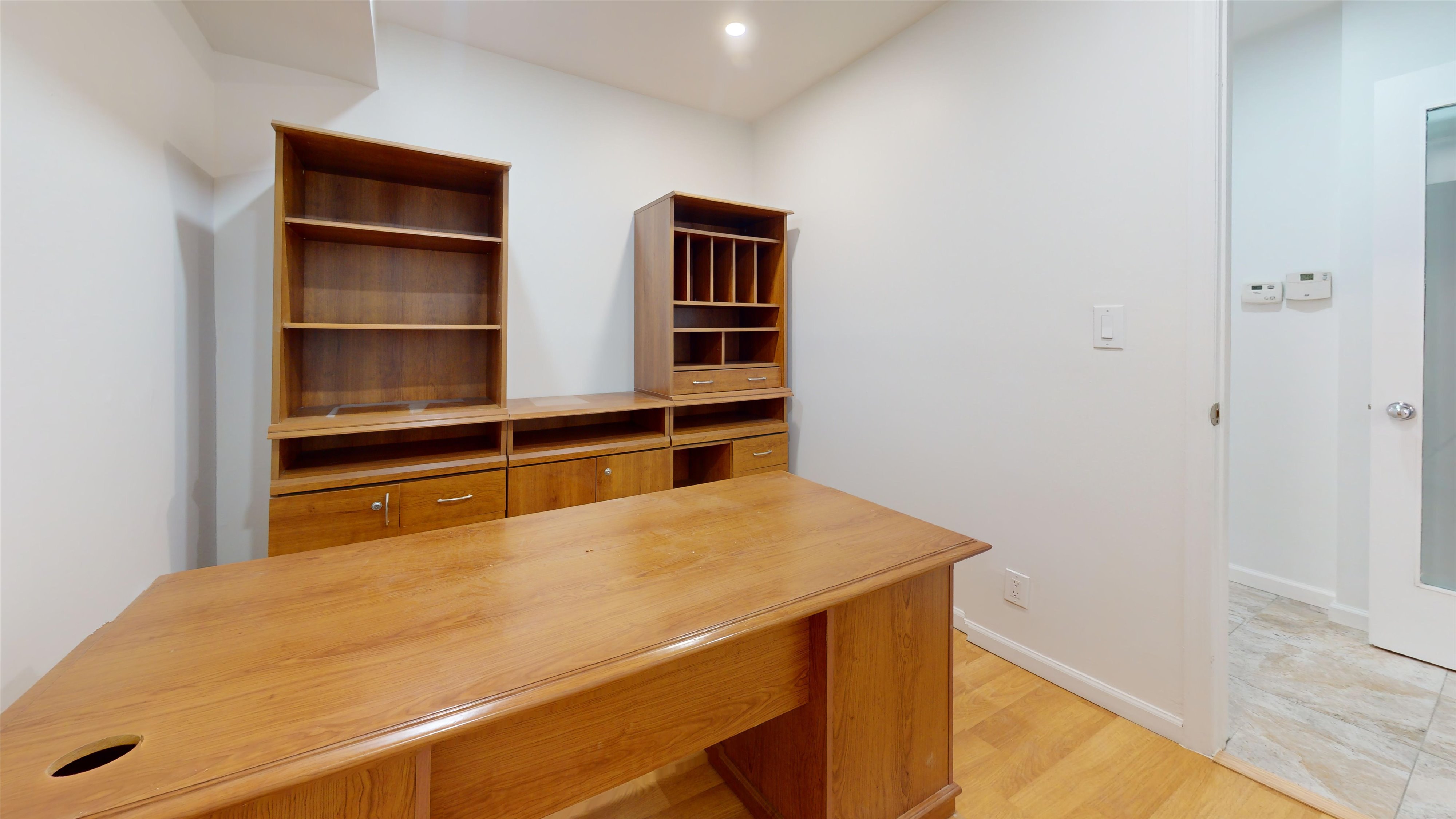 454 77th Street, Unit 1 Brooklyn, NY 11209 - Photo 2 of 10 a bedroom with a bed and cabinet