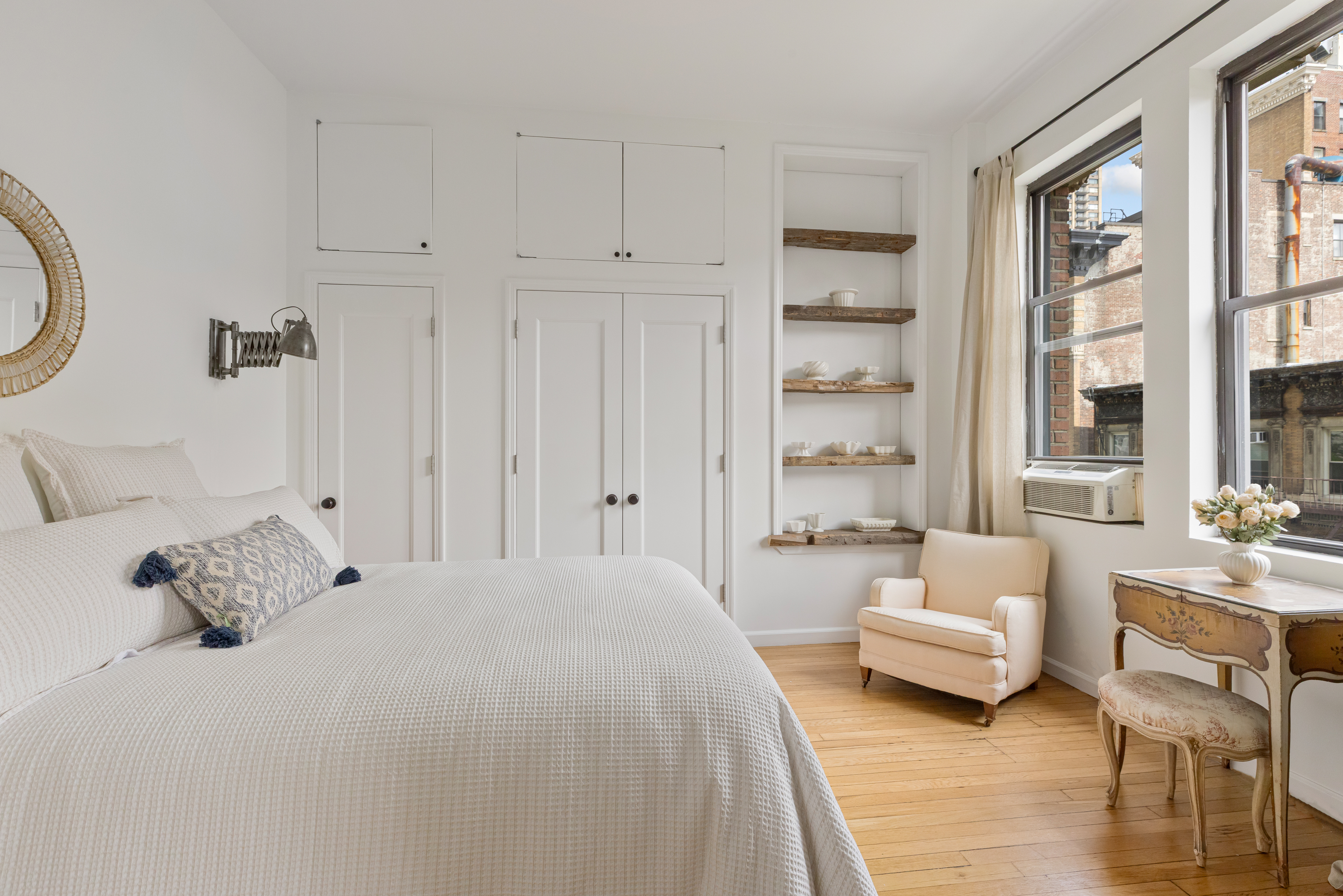 140 West 69th Street, Unit 56A Manhattan, NY 10023 - Photo 6 of 9 a spacious bedroom with a bed and a couch