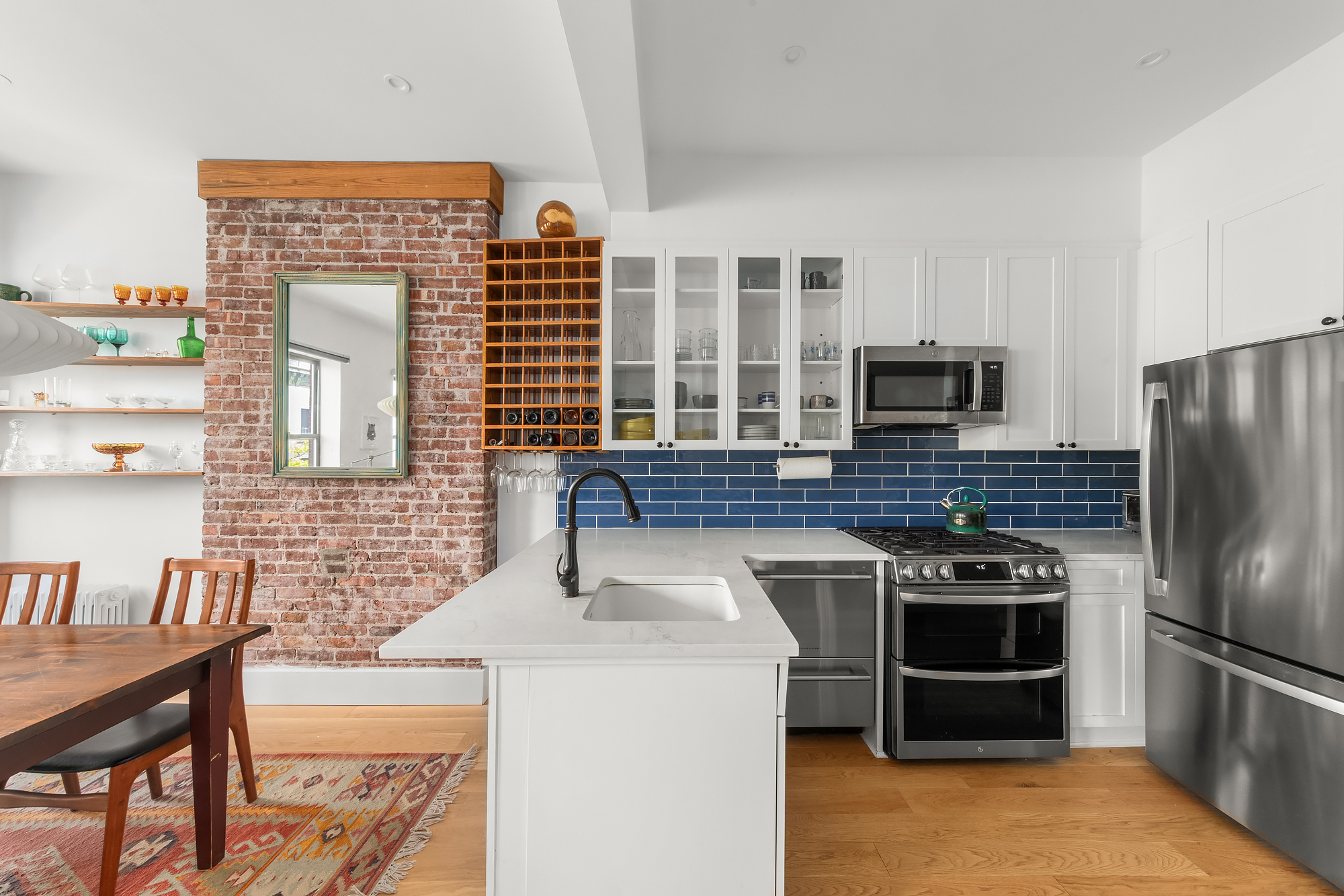 102 Clay Street, Unit 4 Brooklyn, NY 11222 - Photo 4 of 13 a kitchen that has a stove and a refrigerator
