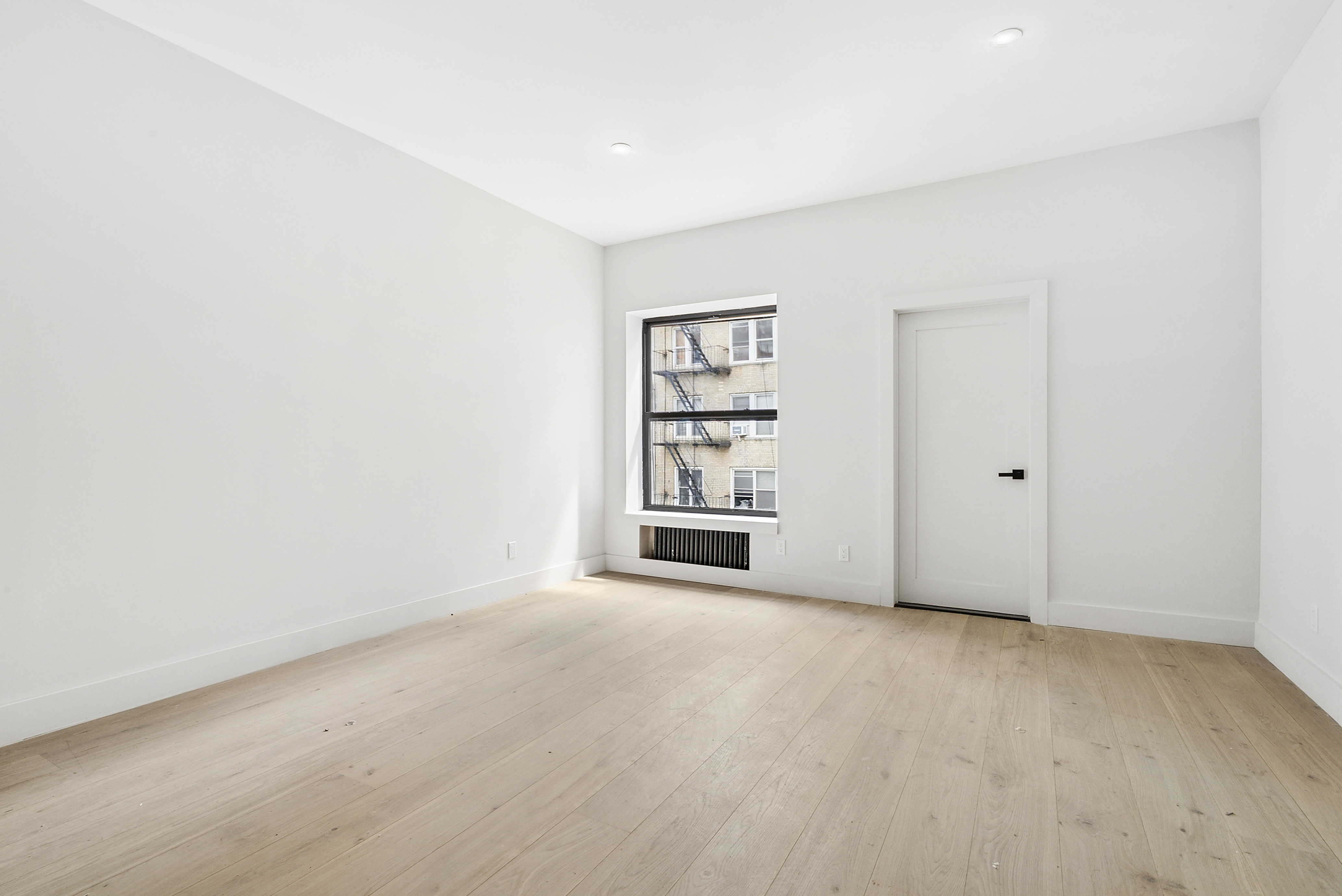 20 East 66th Street, Unit 5B Manhattan, NY 10065 - Photo 2 of 9 an empty room with windows