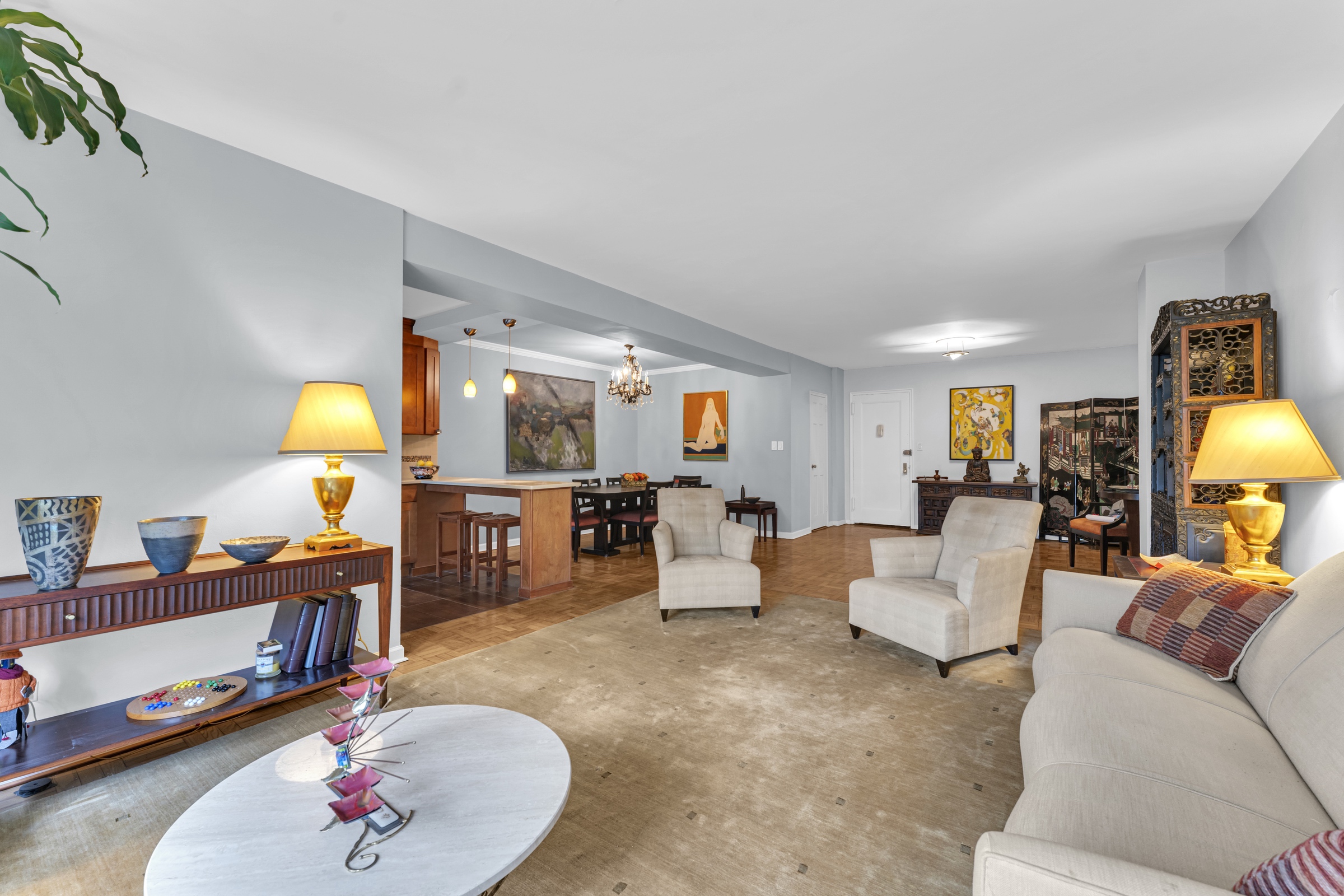 750 Kappock Street, Unit 307 Bronx, NY 10463 - Photo 2 of 20 a living room with furniture and a lamp