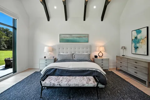 a bathroom with a sink a toilet a shower and a mirror