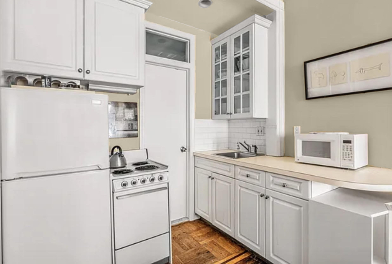 119 West 80th Street, Unit 3F Manhattan, NY 10024 - Photo 3 of 4 a kitchen with cabinets appliances and a counter space