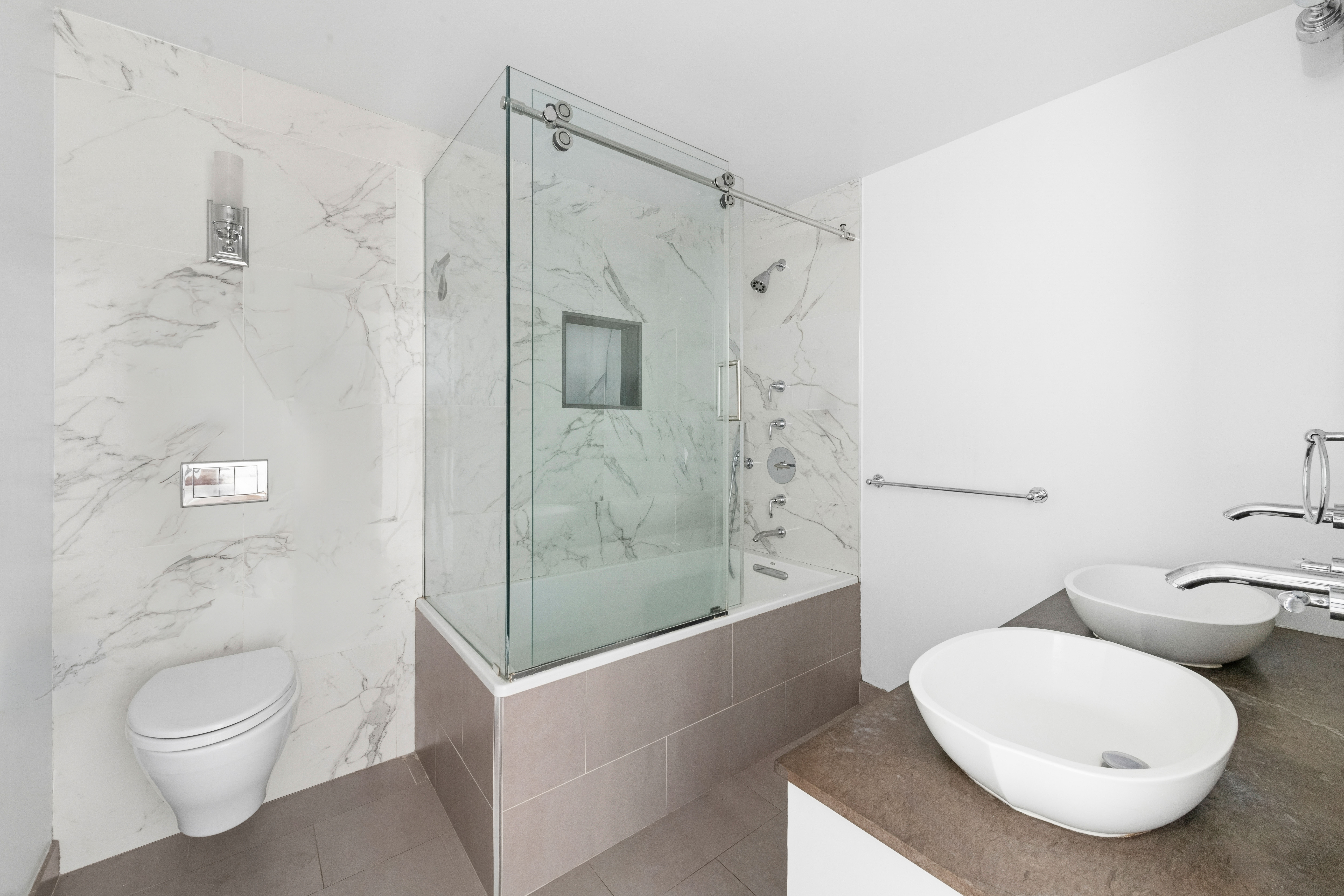 201 East 36th Street, Unit 17C Manhattan, NY 10016 - Photo 8 of 13 a bathroom with a toilet and a shower