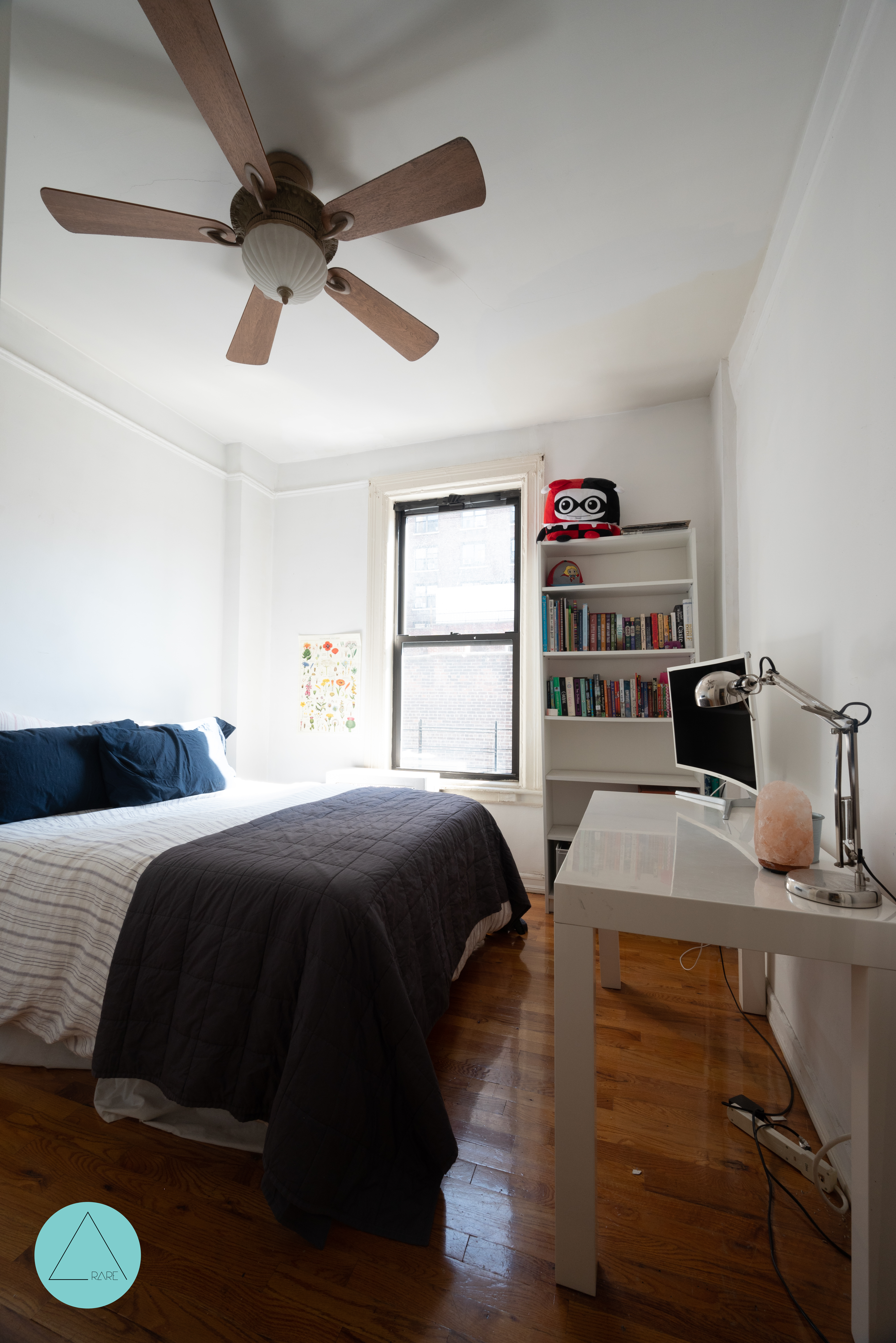 862 West End Avenue, Unit 4R Manhattan, NY 10025 - Photo 4 of 6 a bedroom with a bed and a book shelf