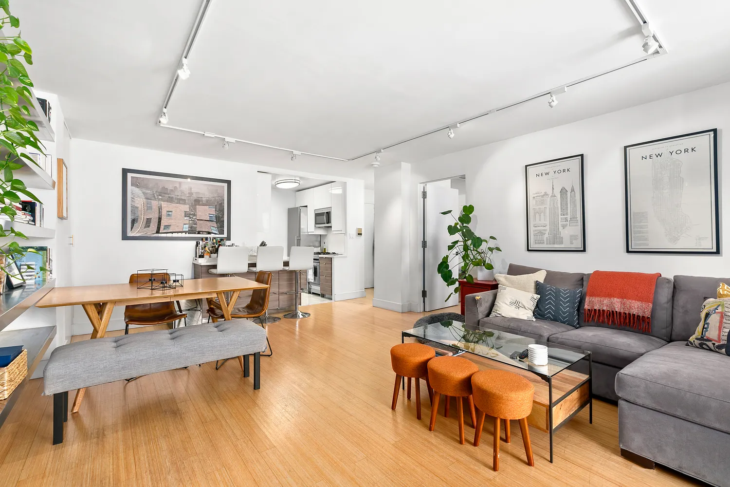 a living room with furniture wooden floor and a table