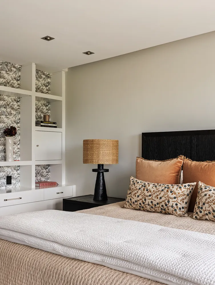 a bedroom with a bed and a night stand