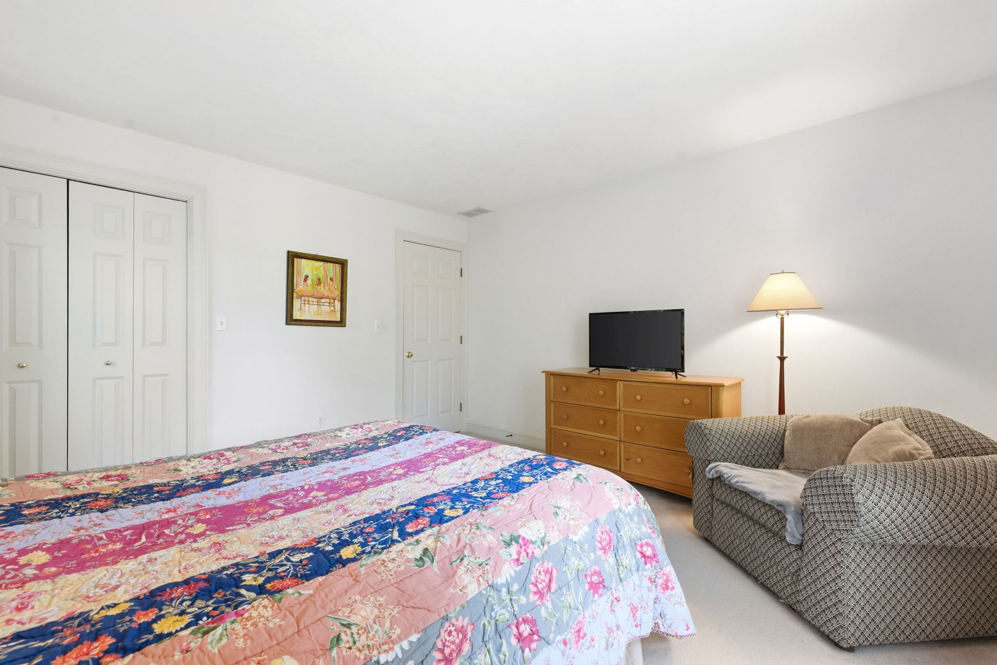 2 Laurel Street Lexington, MA 02421 - Photo 34 of 46 a bedroom with a bed and a flat screen tv