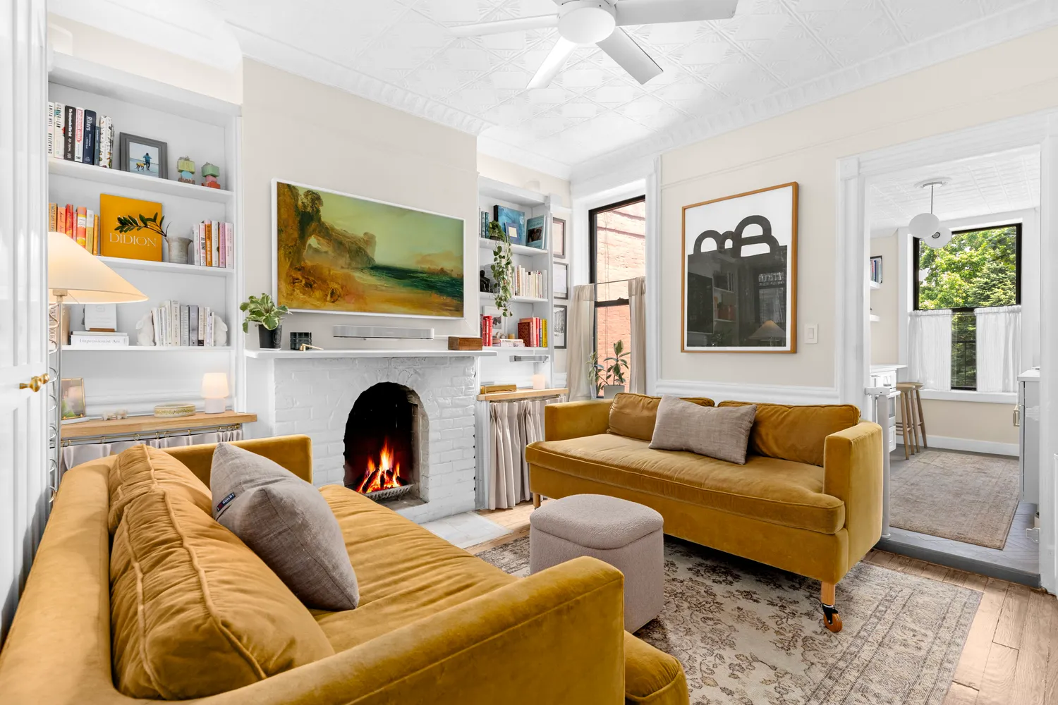 a living room with furniture fireplace and flat screen tv