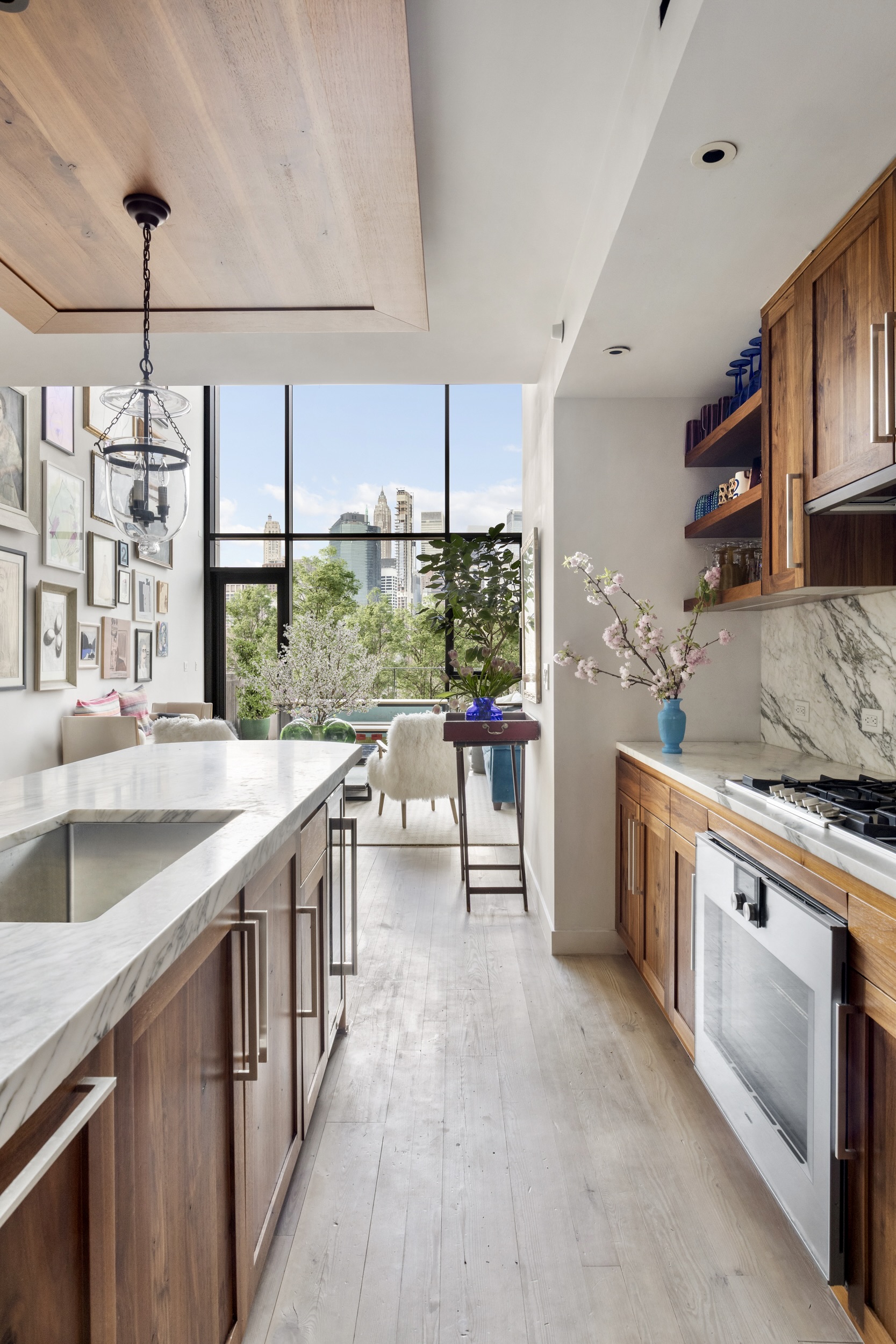 90 Furman Street, Unit N510 Brooklyn, NY 11201 - Photo 14 of 31 a kitchen with stainless steel appliances granite countertop a stove a sink and a refrigerator