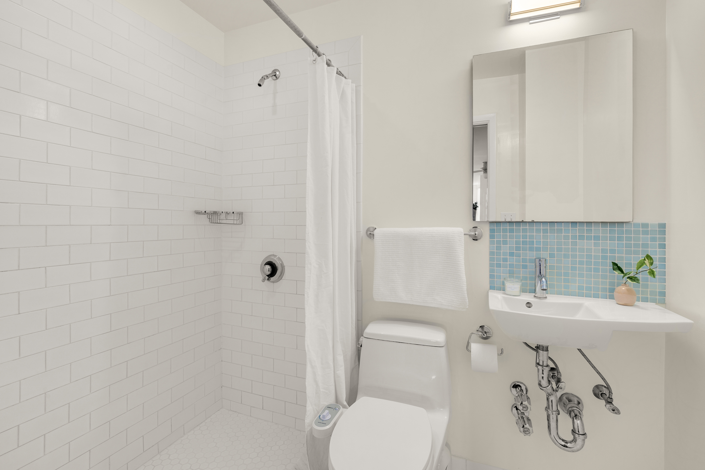 115 Eastern Parkway, Unit 6F Brooklyn, NY 11238 - Photo 8 of 11 a bathroom with a toilet sink and shower