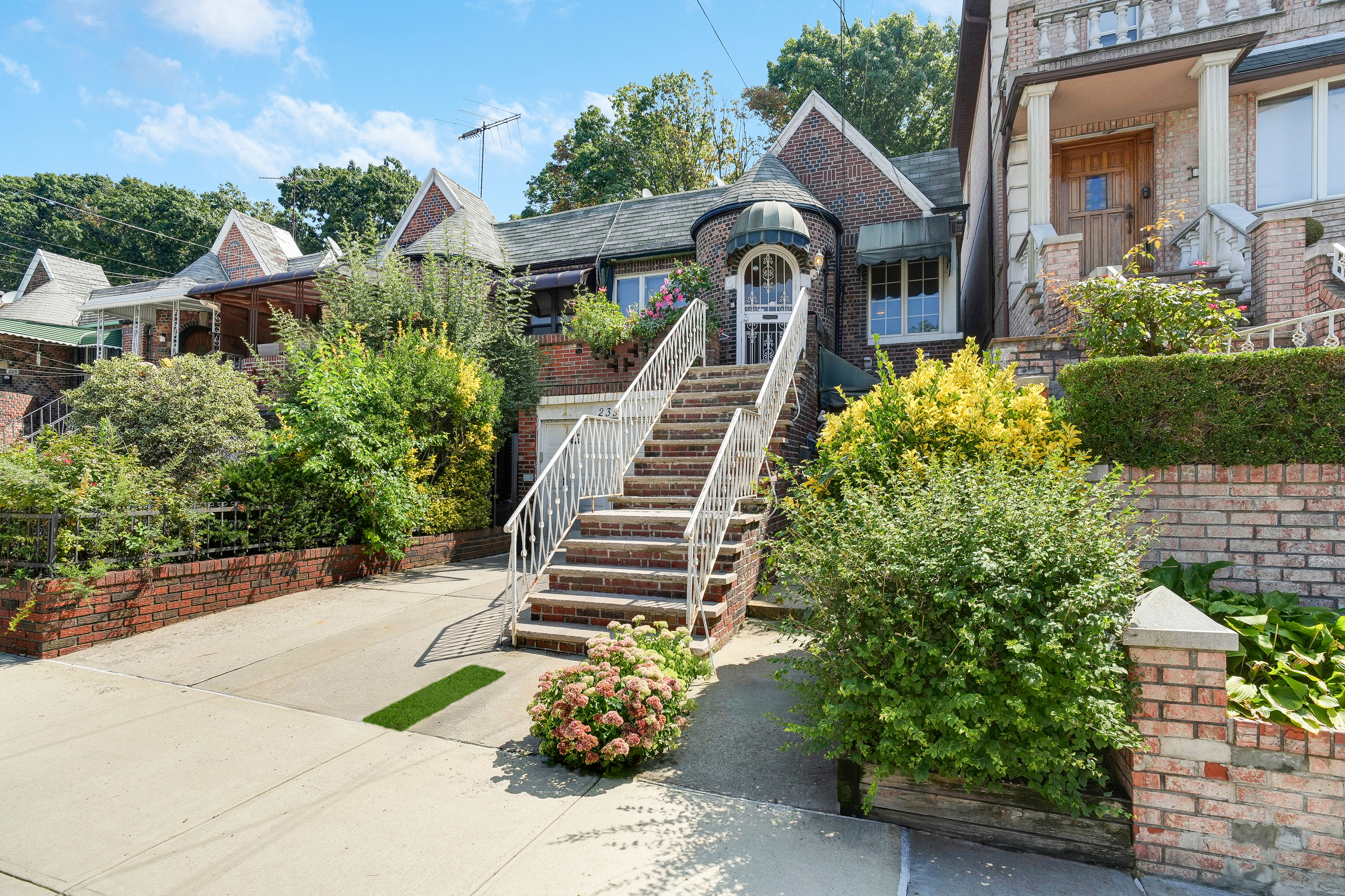 233 Battery Avenue Brooklyn, NY 11209 - Photo 15 of 17 a front view of a house with a garden