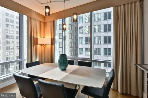 a view of a dining room with furniture and a window