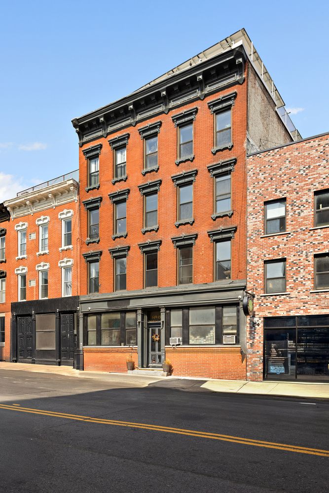 a tall building sitting on the side of a street
