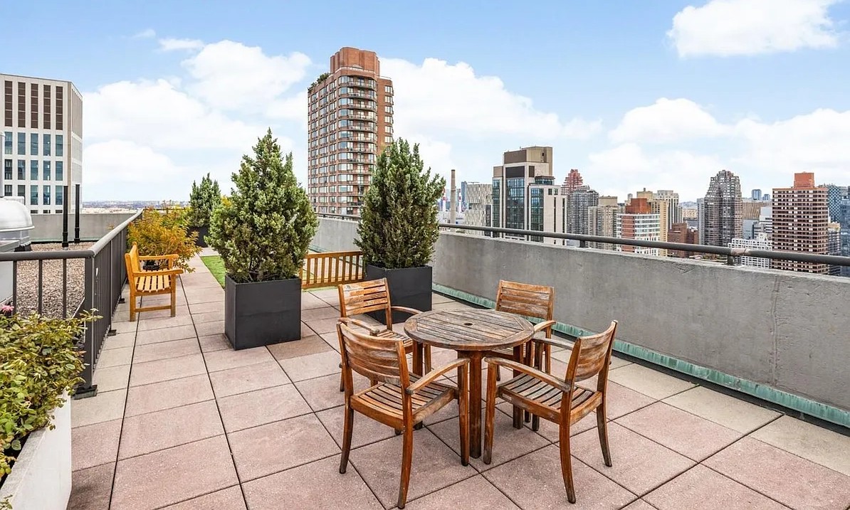 301 East 79th Street, Unit 17F Manhattan, NY 10075 - Photo 13 of 15 a view of a terrace with furniture and stove