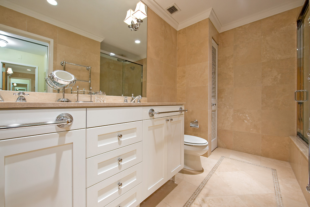 115 4th Avenue, Unit 5C Manhattan, NY 10003 - Photo 10 of 11 a bathroom with a sink a toilet a mirror and shower