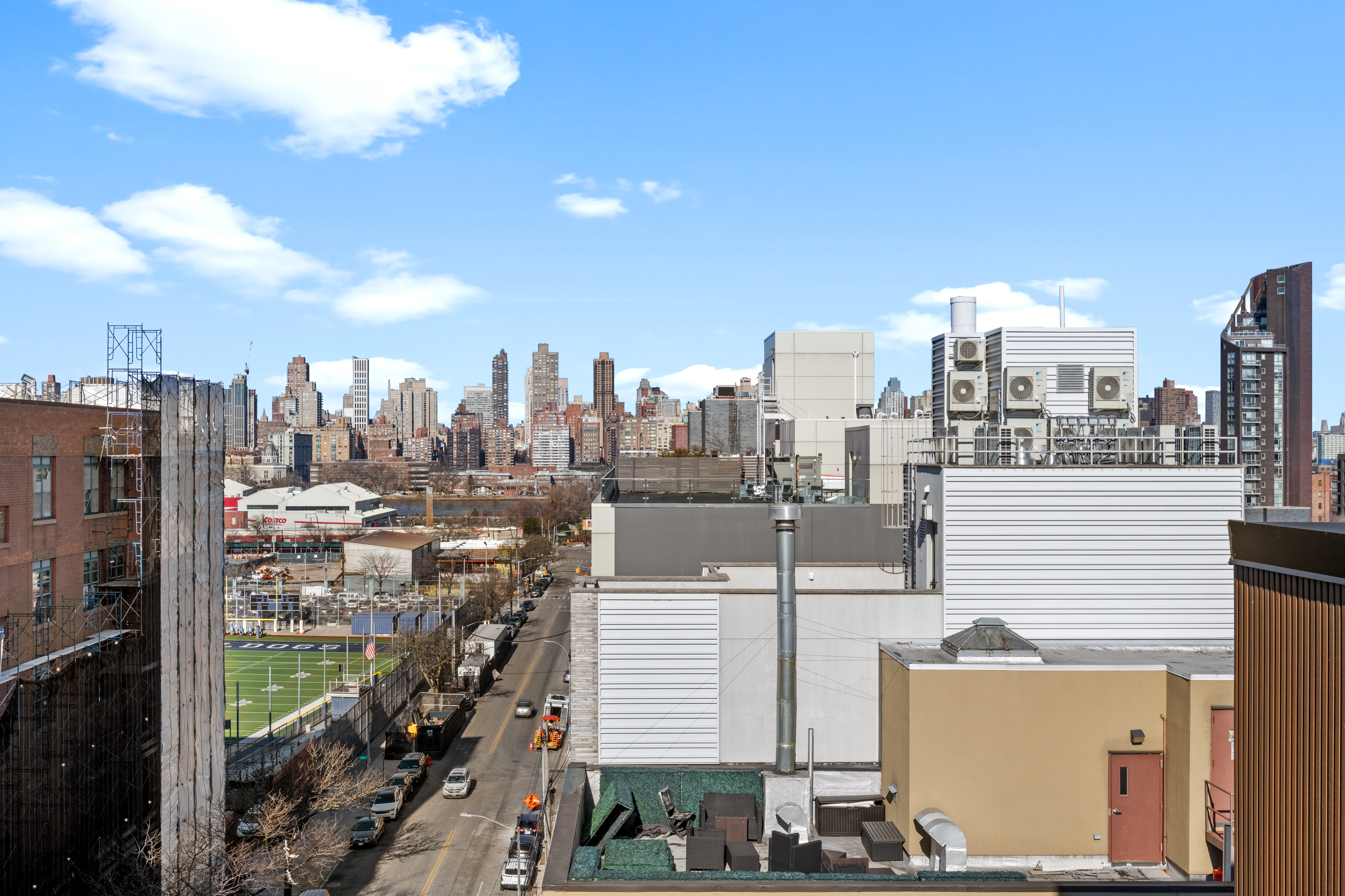 14-35 Broadway, Unit PH Queens, NY 11106 - Photo 22 of 24 a view of a city with tall buildings