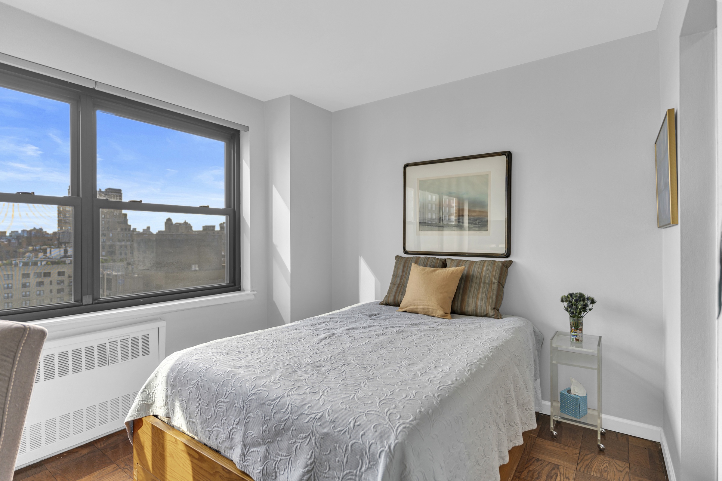 205 West End Avenue, Unit 23E Manhattan, NY 10023 - Photo 4 of 15 a bedroom with a large bed and a window
