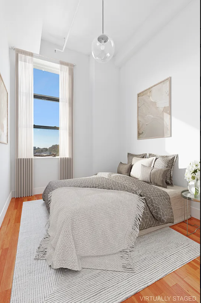 180 Bainbridge Street, Unit 407 Brooklyn, NY 11233 - Photo 2 of 22 a bedroom with a large bed and a window
