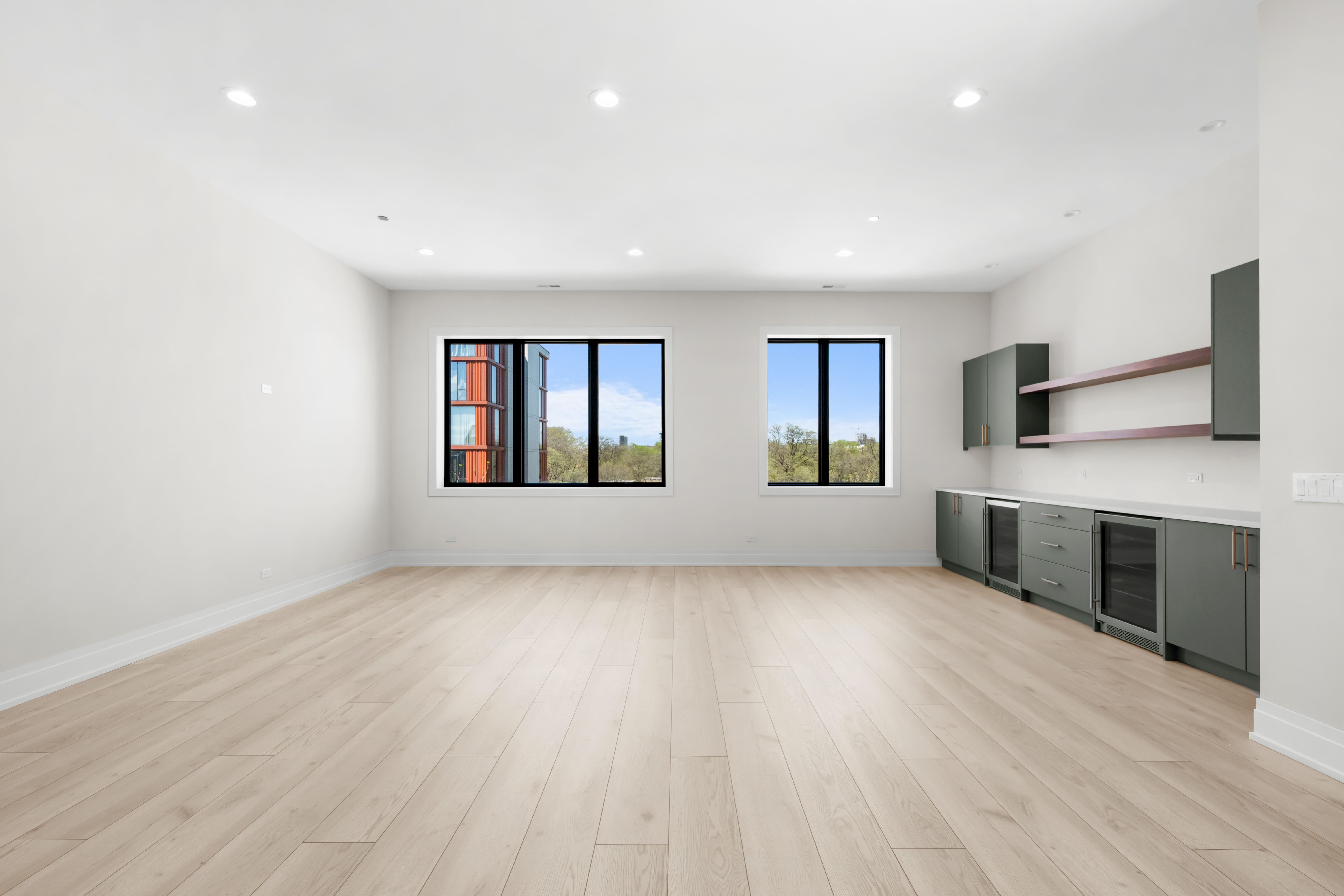 1327 West Taylor Street, Unit 4 Chicago, IL 60607 - Photo 8 of 27 an empty room with wooden floor windows and fireplace