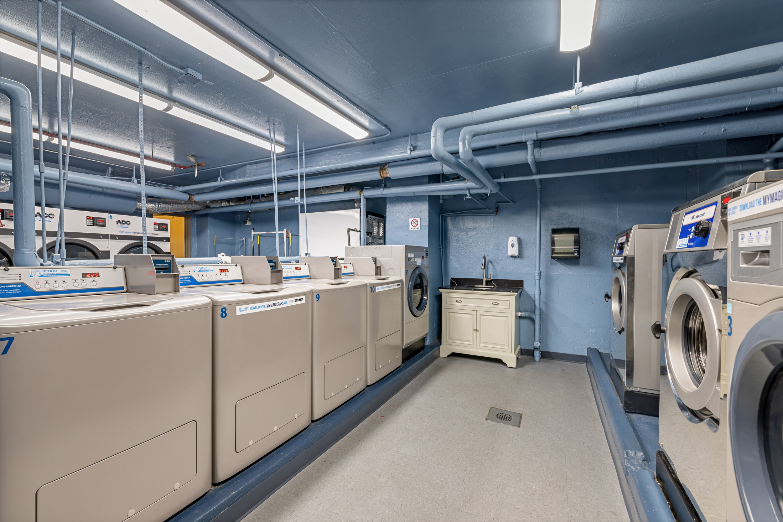 330 3rd Avenue, Unit 18F Manhattan, NY 10010 - Photo 8 of 10 a utility room with dryer and washer