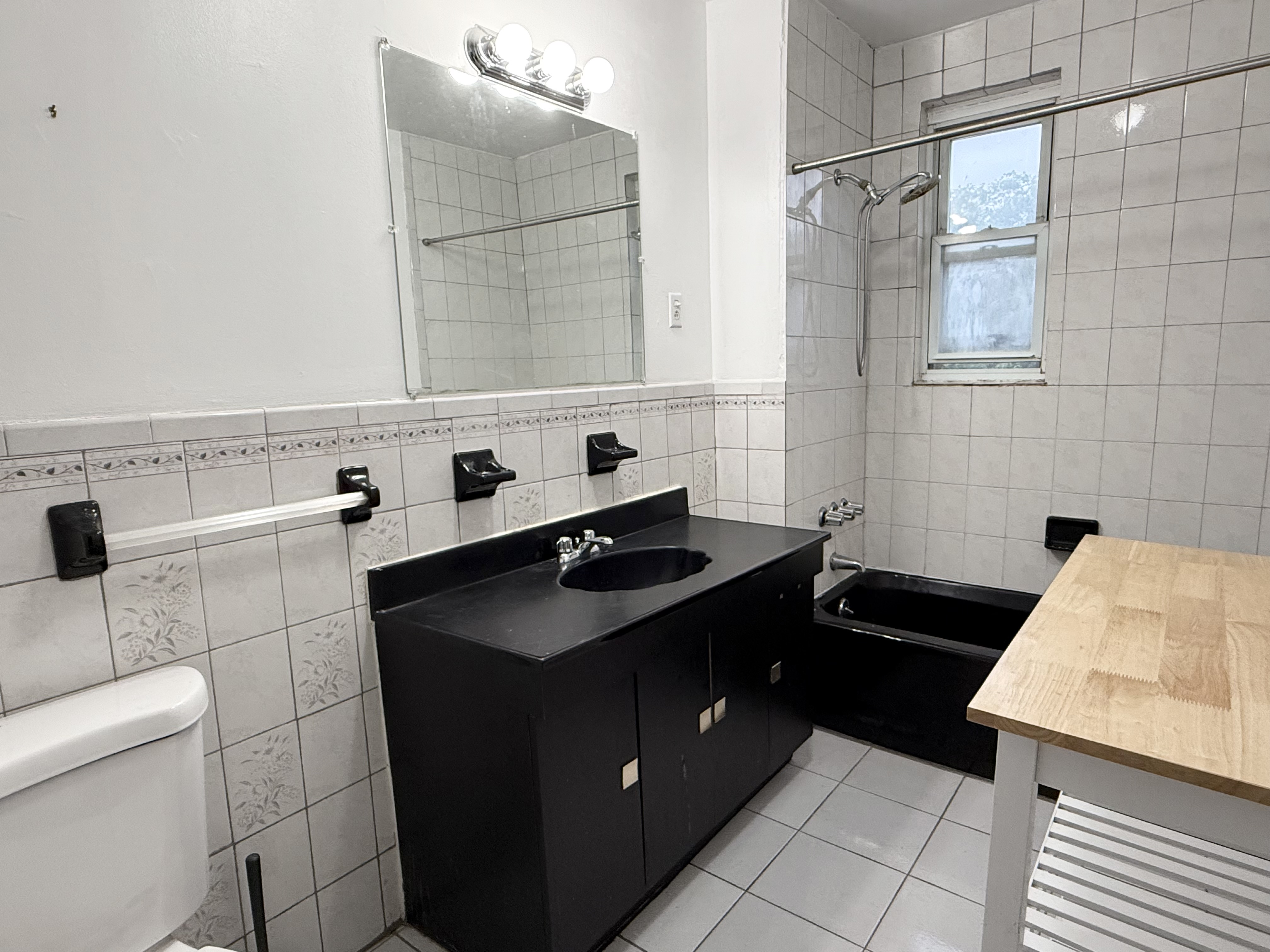 149 7th Avenue, Unit 4 Brooklyn, NY 11215 - Photo 4 of 9 a kitchen with a sink stove and cabinets