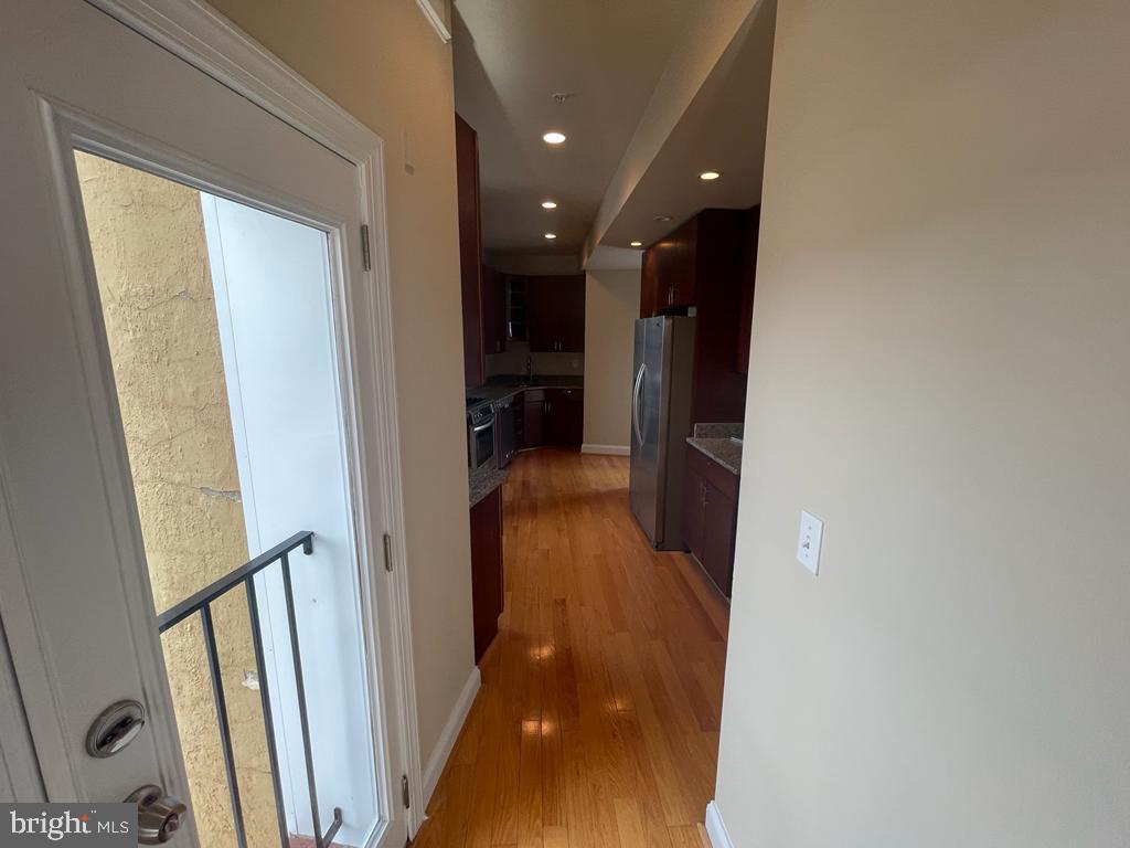 1033 Park Road Northwest, Unit 6 Washington, DC 20010 - Photo 8 of 38 a view of a hallway with wooden floor and staircase