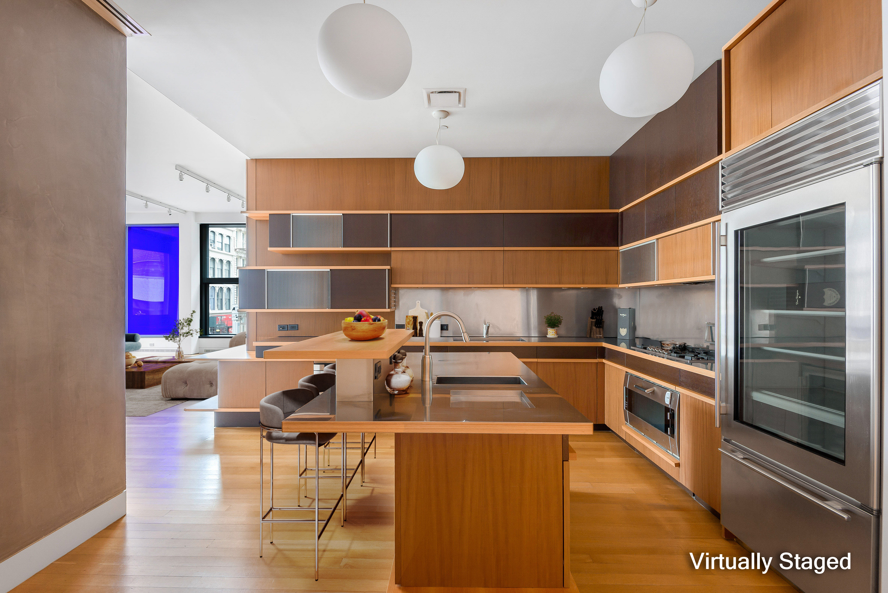 40 Mercer Street, Unit 19 Manhattan, NY 10013 - Photo 3 of 16 a kitchen with a sink dishwasher and a stove with wooden floor