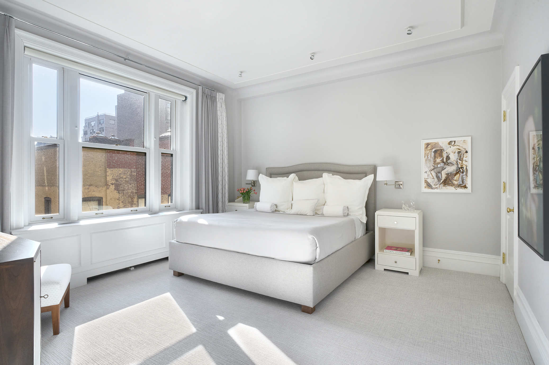 850 Park Avenue, Unit 7D Manhattan, NY 10075 - Photo 10 of 20 a white bed sitting in a bedroom next to a window