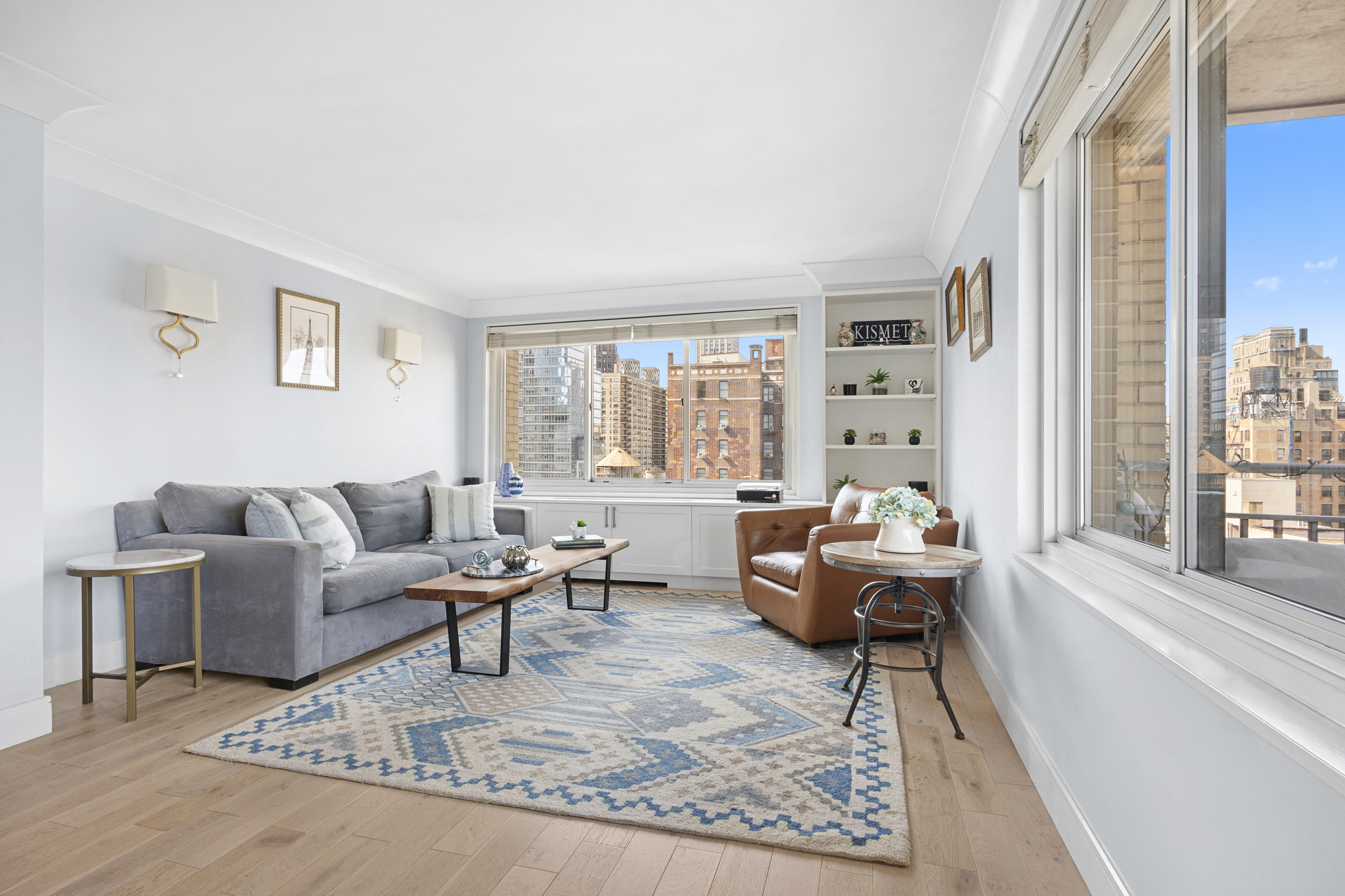 201 West 70th Street, Unit 16C Manhattan, NY 10023 - Photo 2 of 20 a living room with furniture and a large window