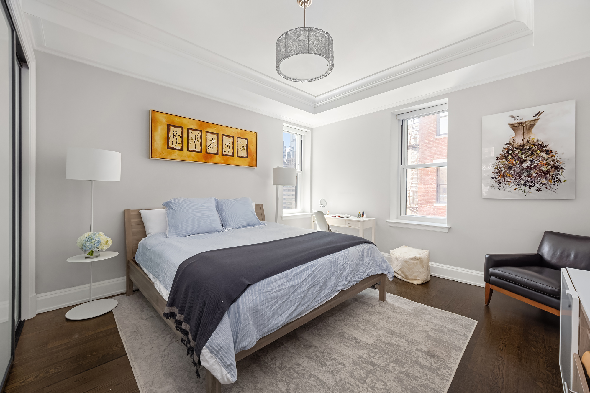 344 West 72nd Street, Unit 1007 Manhattan, NY 10023 - Photo 9 of 23 a spacious bedroom with a bed and window