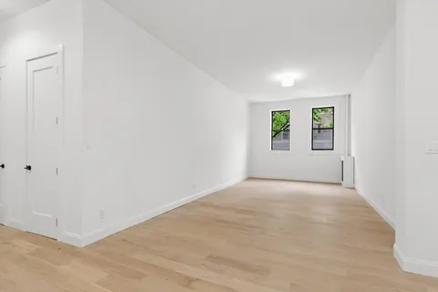 a view of empty room with windows