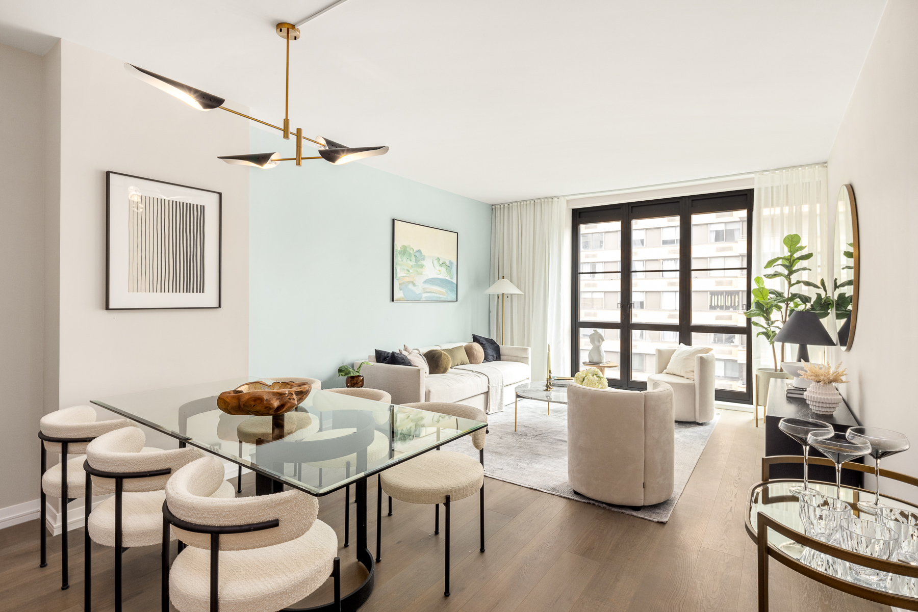 250 West 96th Street, Unit 8B Manhattan, NY 10025 - Photo 3 of 25 a living room with furniture a flat screen tv and a window