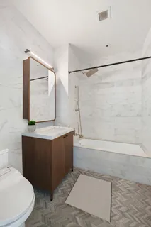 a bathroom with a bathtub and shower
