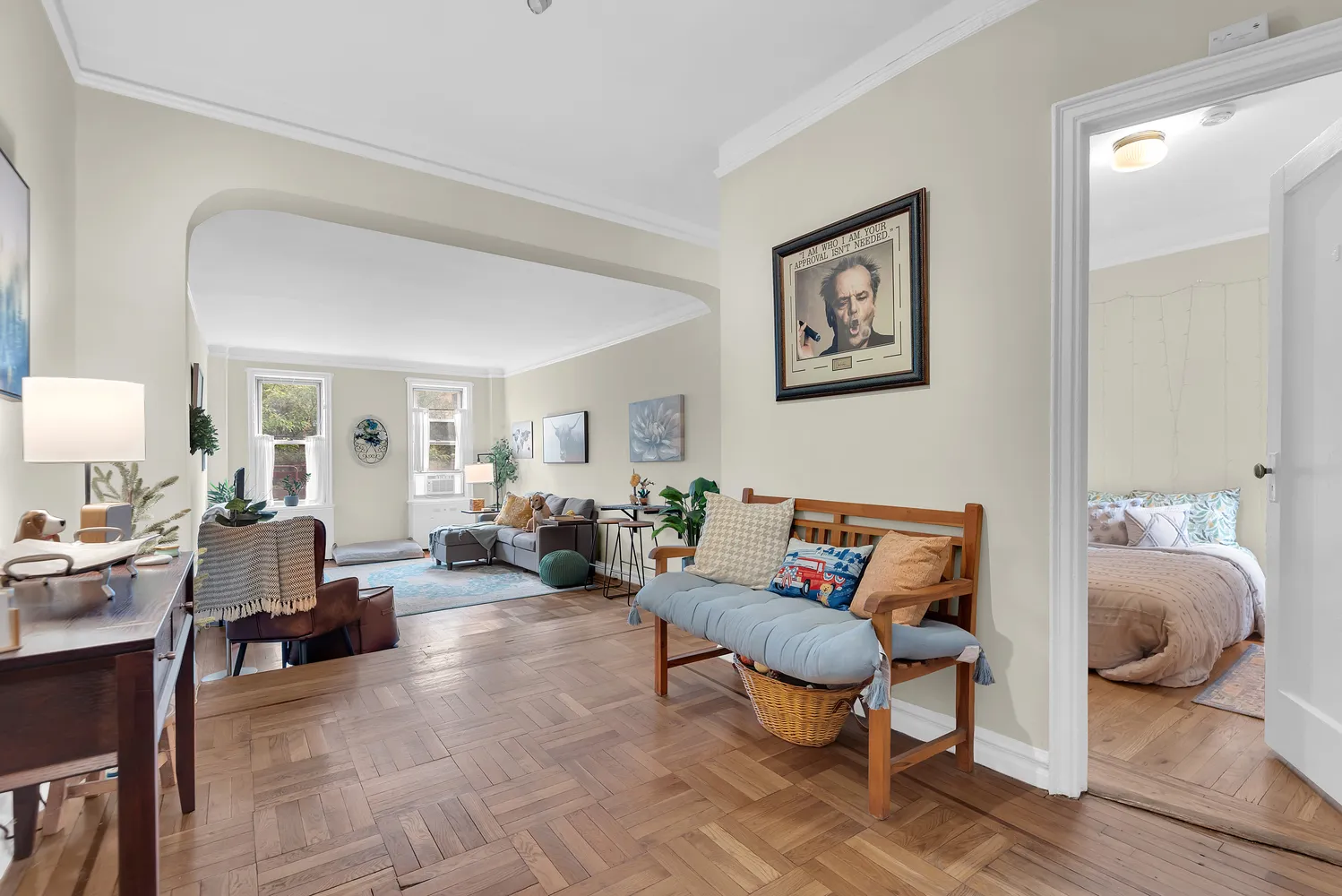 a living room with furniture a rug and a lamp