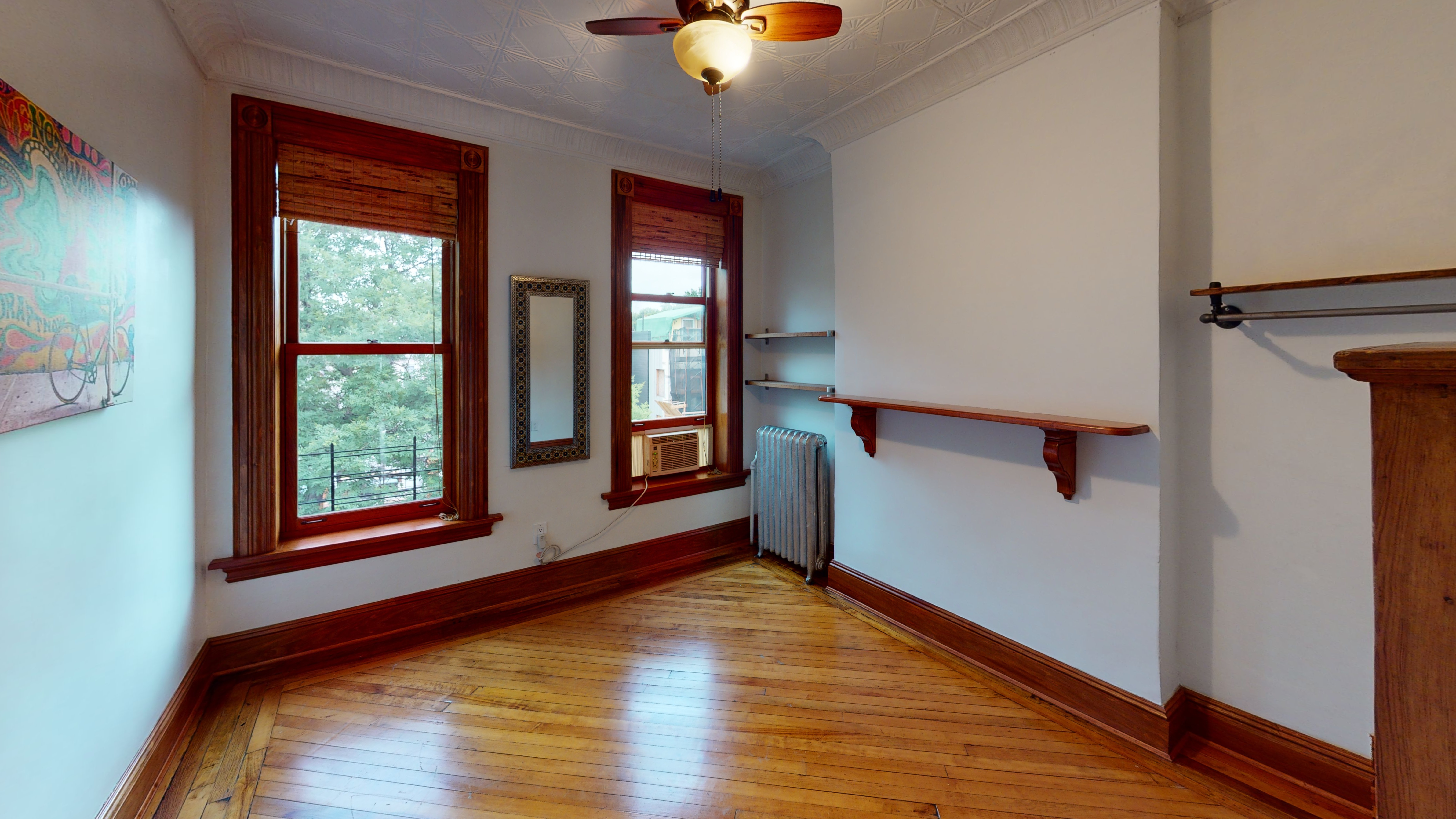 332 15th Street, Unit 3 Brooklyn, NY 11215 - Photo 6 of 8 a view of an empty room with window and wooden floor