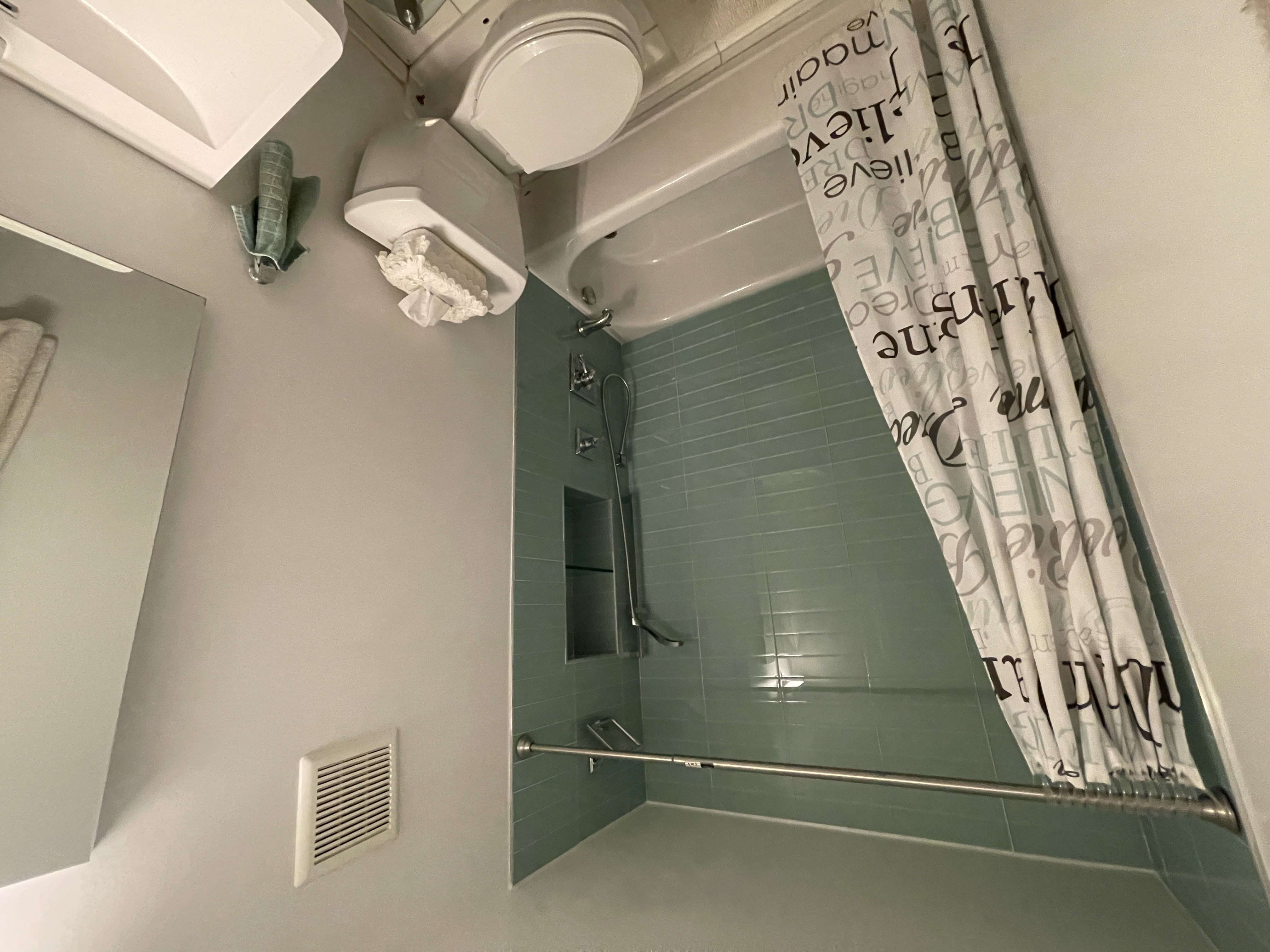 25-40 Shore Boulevard, Unit 15T Queens, NY 11102 - Photo 12 of 24 a bathroom with a toilet and a bathtub