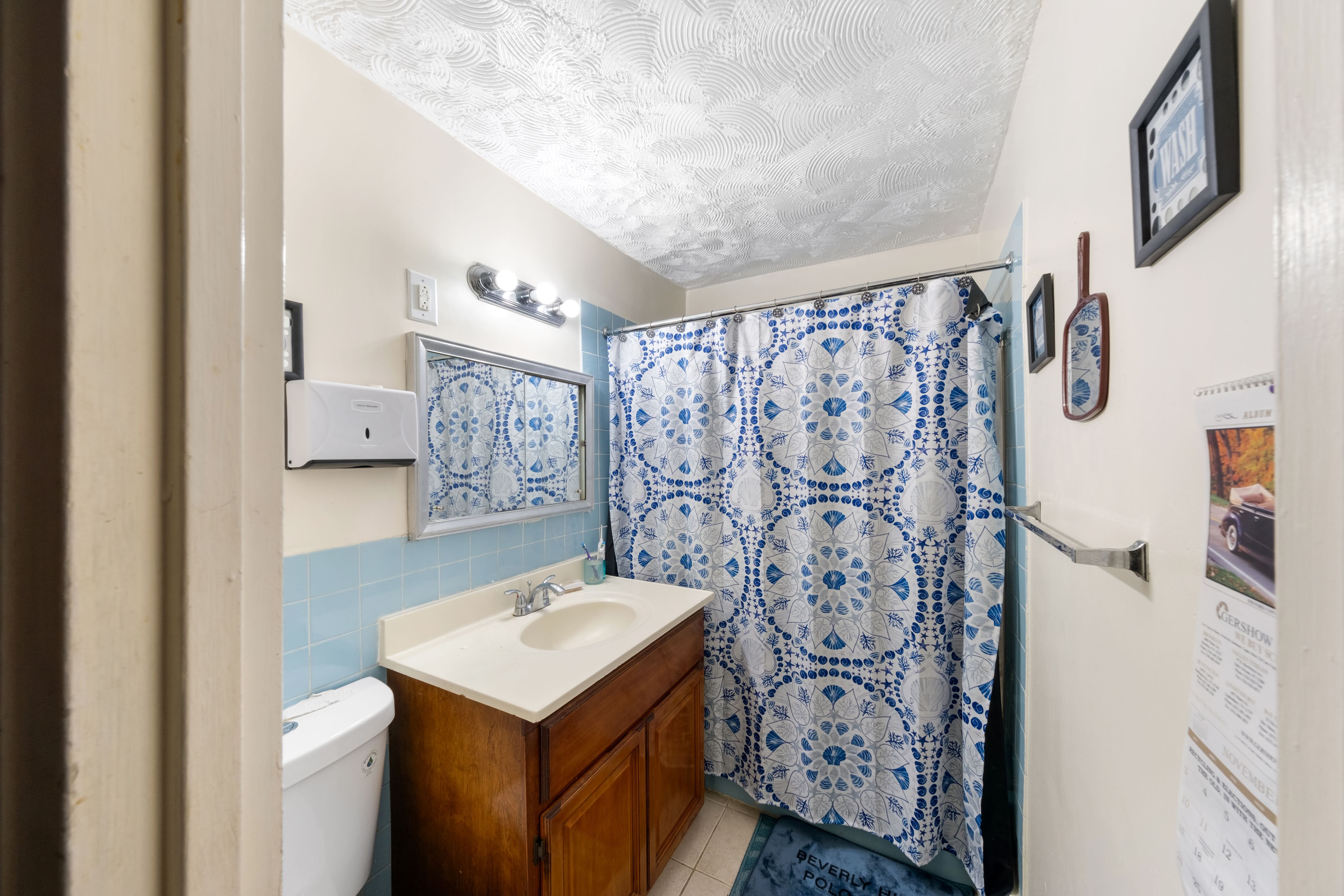 1464 East 84th Street Brooklyn, NY 11236 - Photo 6 of 22 a bathroom with a sink toilet and shower