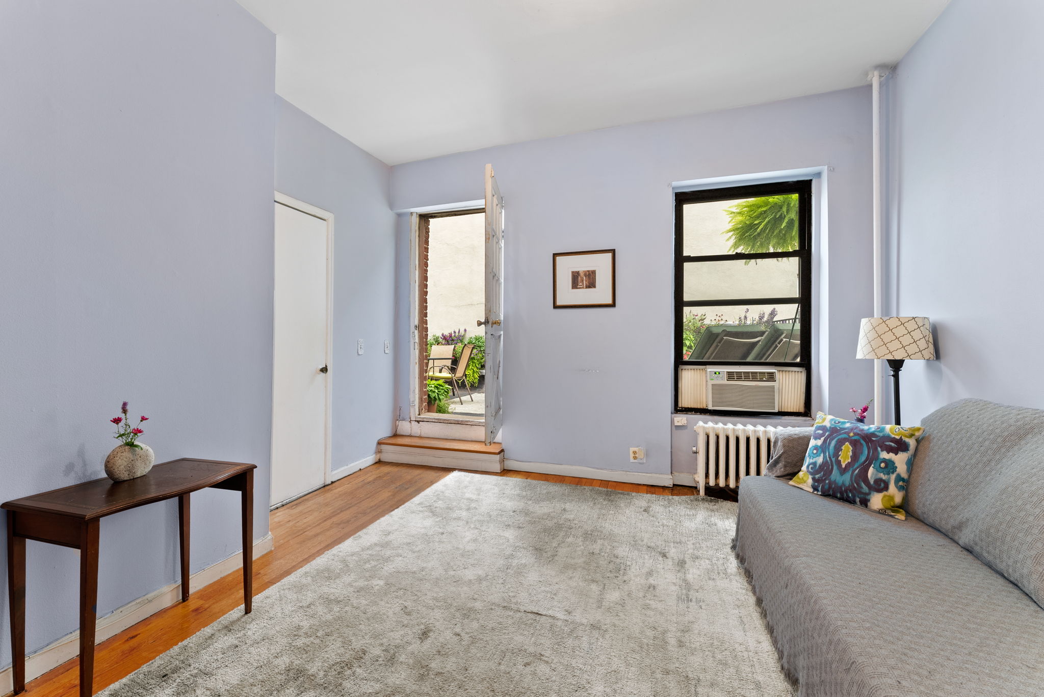 311 Henry Street, Unit 3 Brooklyn, NY 11201 - Photo 3 of 10 a living room with furniture and window