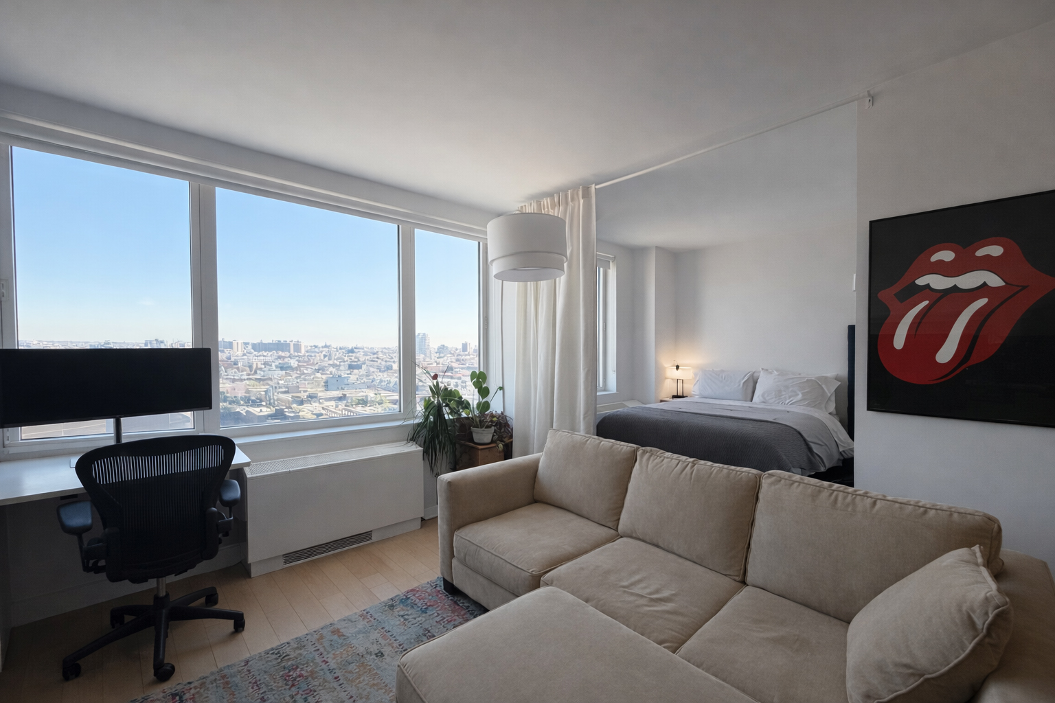 22 North 6th Street, Unit 19I Brooklyn, NY 11249 - Photo 3 of 8 a living room with furniture and a flat screen tv