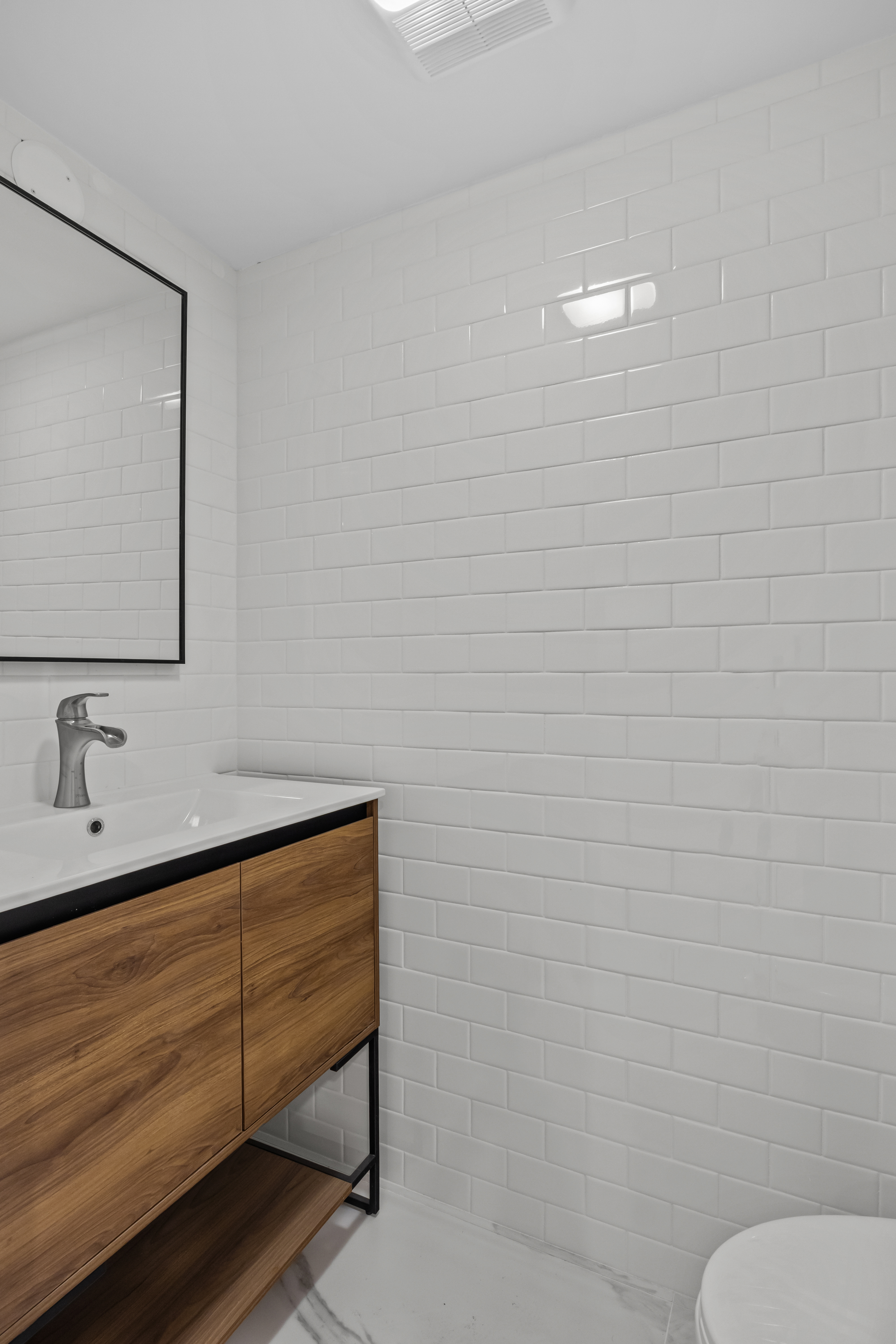 320 10th Street Brooklyn, NY 11215 - Photo 31 of 41 a bathroom with a sink and a mirror