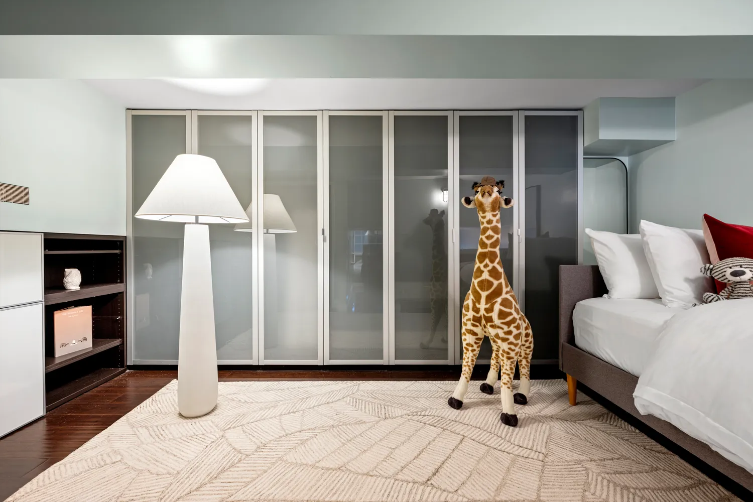 a bedroom with bed and window