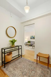 a view of a workspace with furniture and a potted plant