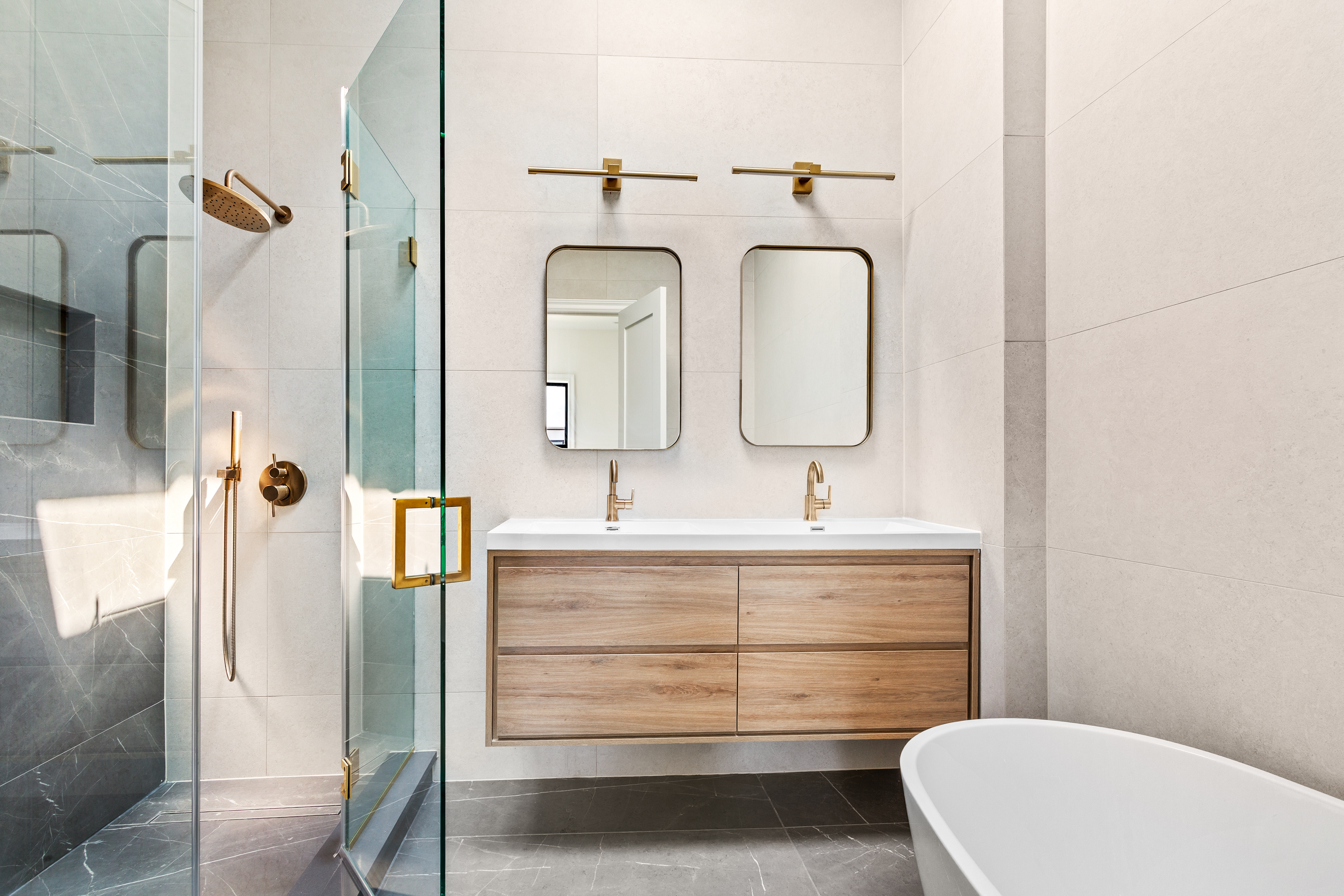 111 Harman Street Brooklyn, NY 11221 - Photo 6 of 12 a bathroom with a toilet sink and mirror