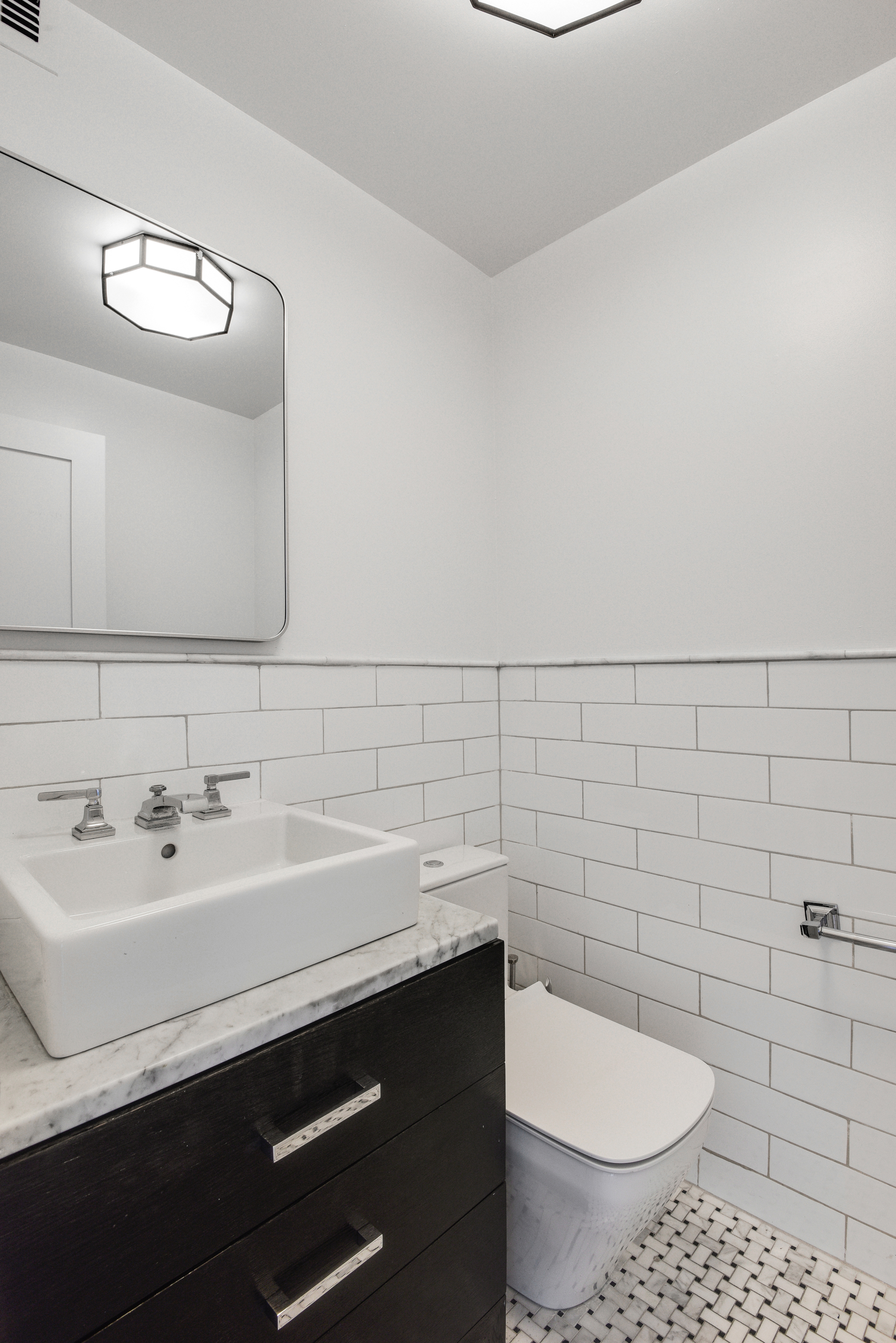 400 East 70th Street, Unit 3005 Manhattan, NY 10021 - Photo 12 of 18 a bathroom with a sink and a toilet
