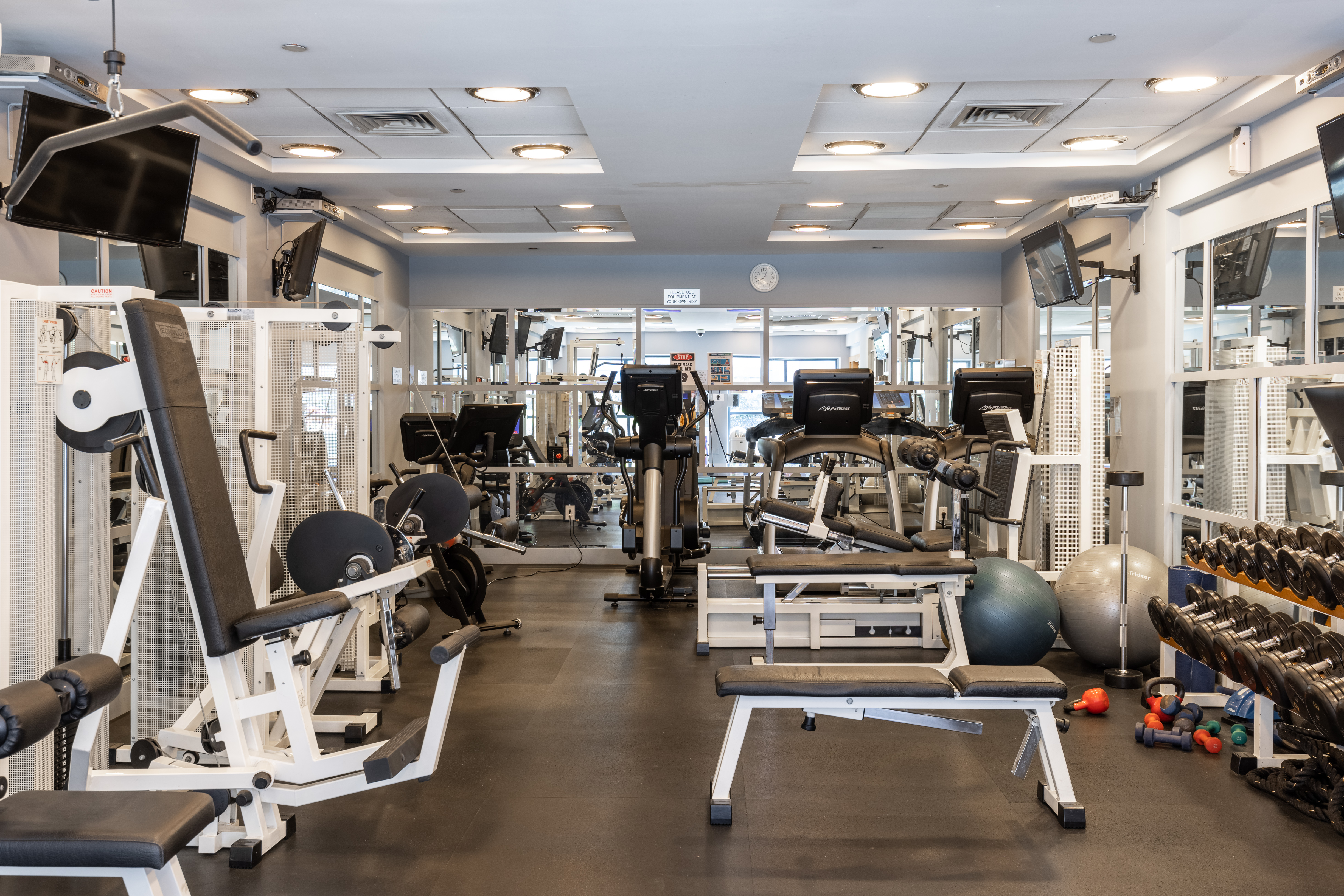 404 East 76th Street, Unit 7D Manhattan, NY 10021 - Photo 8 of 12 a view of a room with gym equipment
